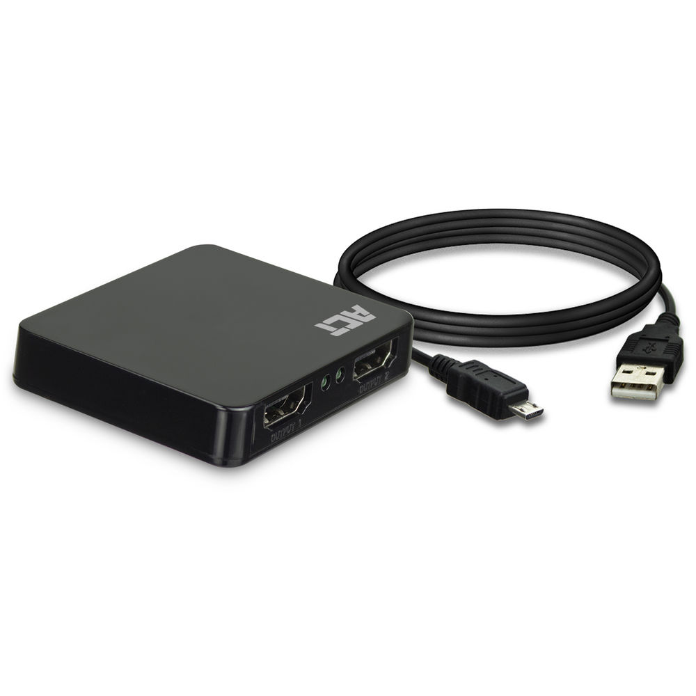 Ein schwarzes ACT-Gerät mit zwei Ausgangsanschlüssen, einem USB-Kabel und einem Micro-USB-Kabel. Das Gerät befindet sich auf einer weißen Oberfläche.