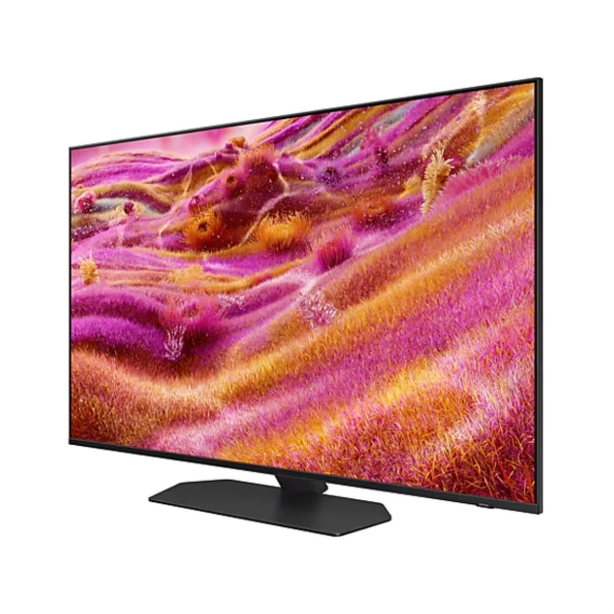Un grande televisore mostra un paesaggio astratto con tonalità rosa, arancioni e gialle. Il televisore è nero e poggia su un supporto nero.