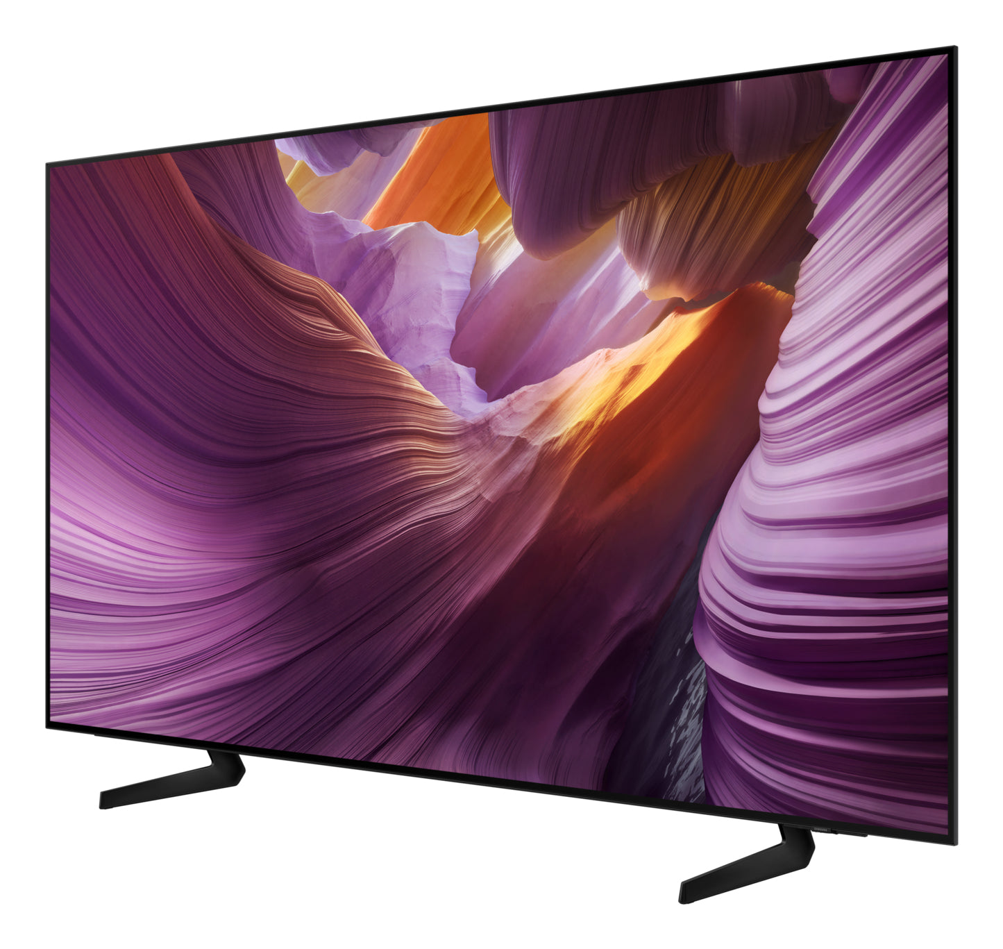 Duży, nowoczesny telewizor wyświetla kolorowy, abstrakcyjny krajobraz. Telewizor jest pochylony i stoi na dwóch czarnych nóżkach.