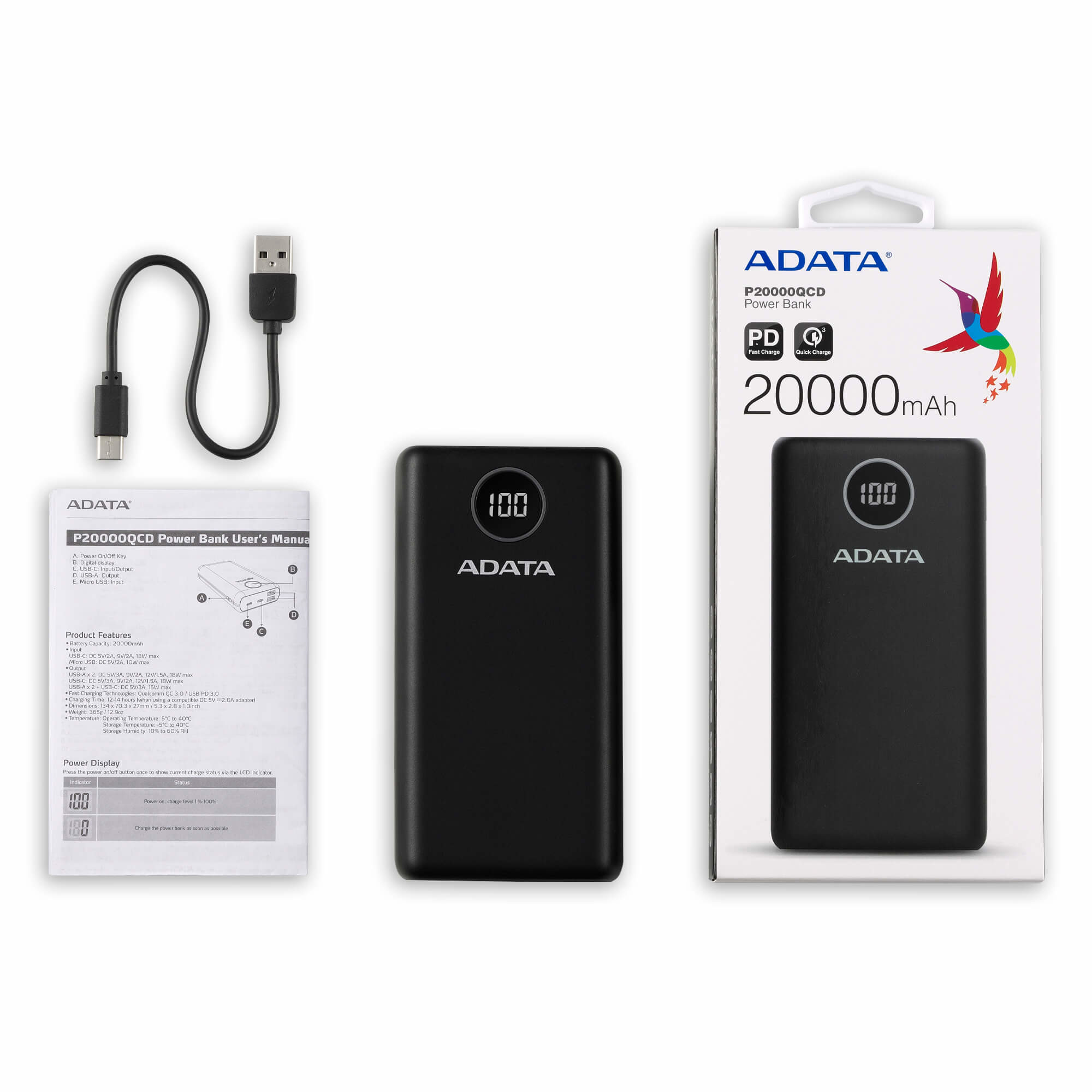Une batterie externe noire avec affichage numérique à 100%, un câble et un manuel sur une surface blanche.
