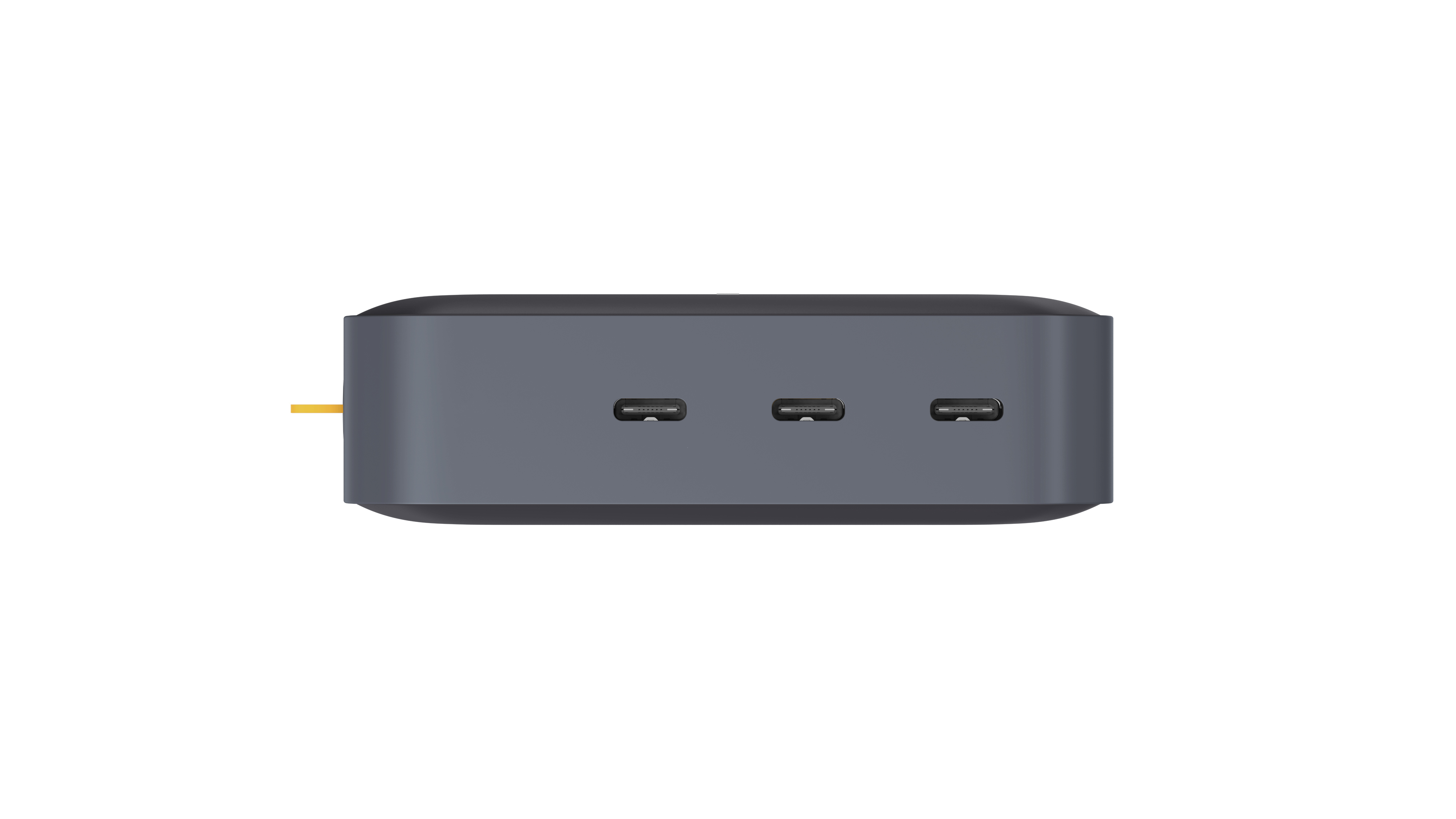 Ein graues rechteckiges Gerät mit drei USB-C-Anschlüssen auf weißem Hintergrund. Ein gelbes Kabel erstreckt sich von links.