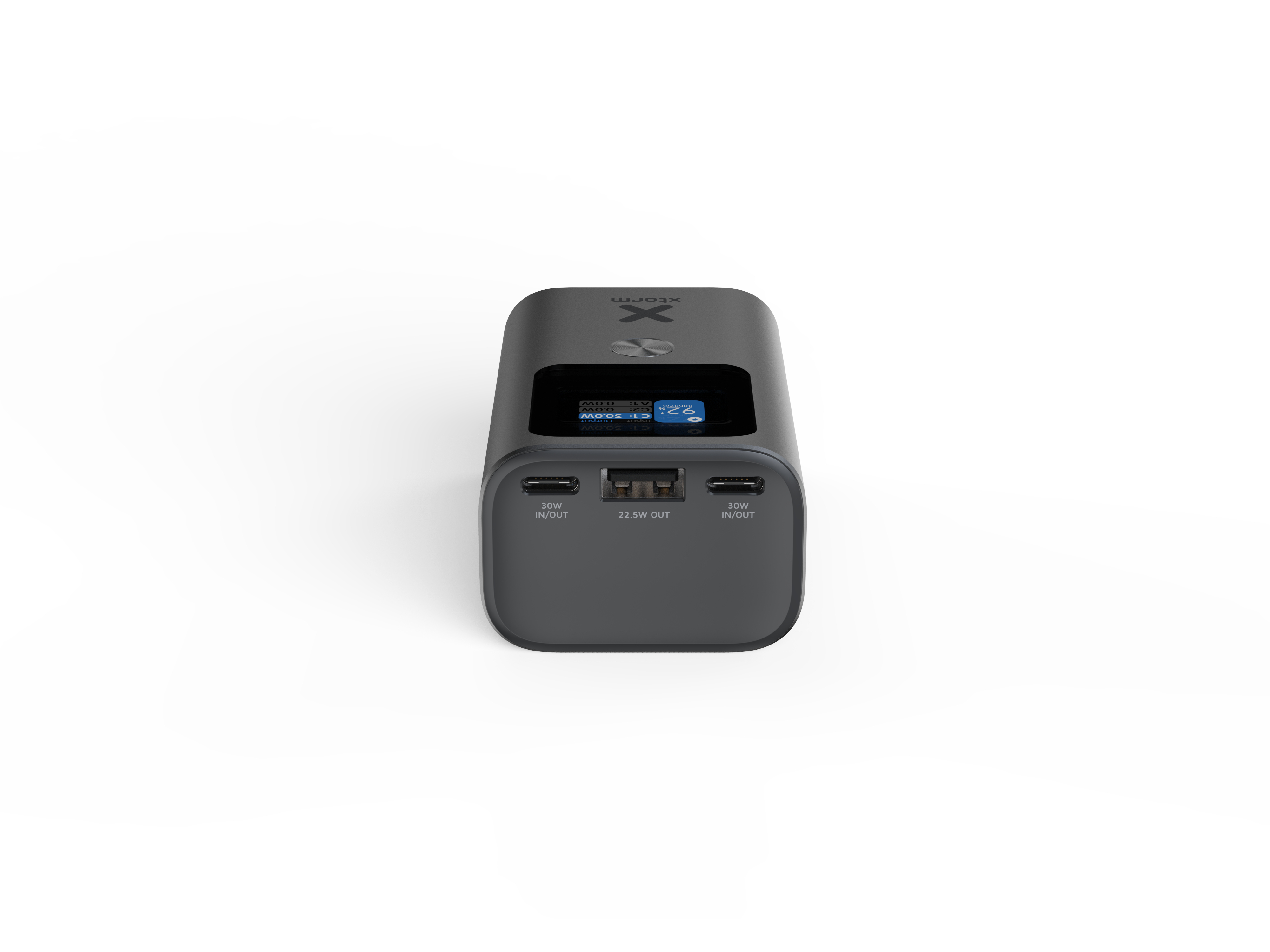 Une batterie externe rectangulaire gris foncé avec un petit écran affichant l'heure et les détails de charge, fond blanc.