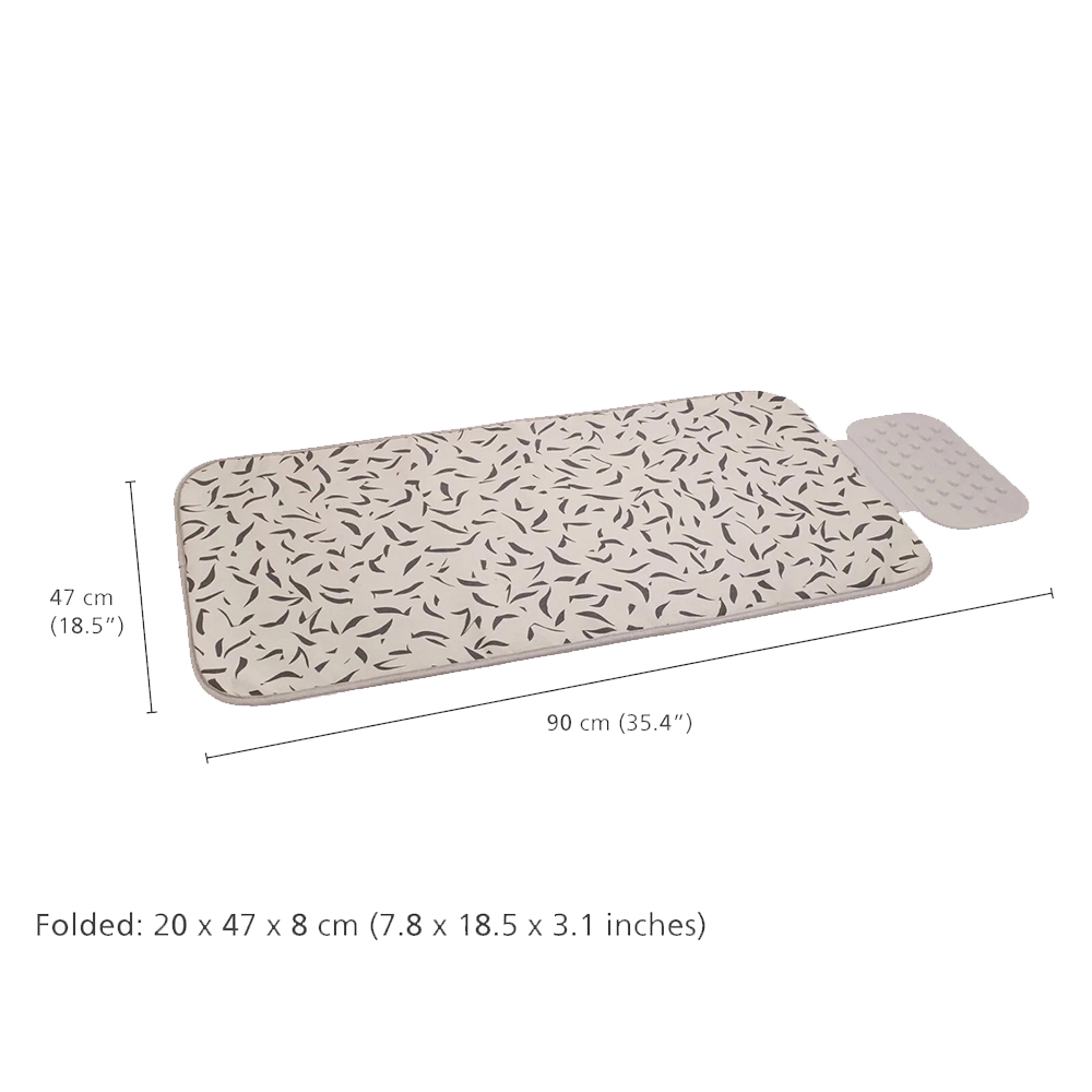 Un cambiador beige con un patrón de hojas y una sección rectangular blanca. Las dimensiones están etiquetadas con medidas en cm y pulgadas.