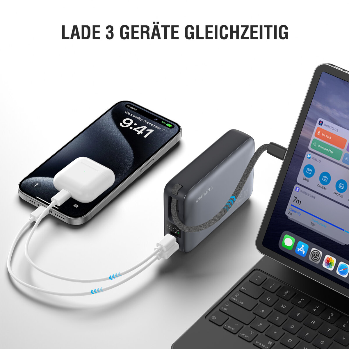 Un téléphone, des écouteurs et une tablette se chargent à partir d'une batterie externe. Le téléphone affiche l'heure 9h41 un mercredi.