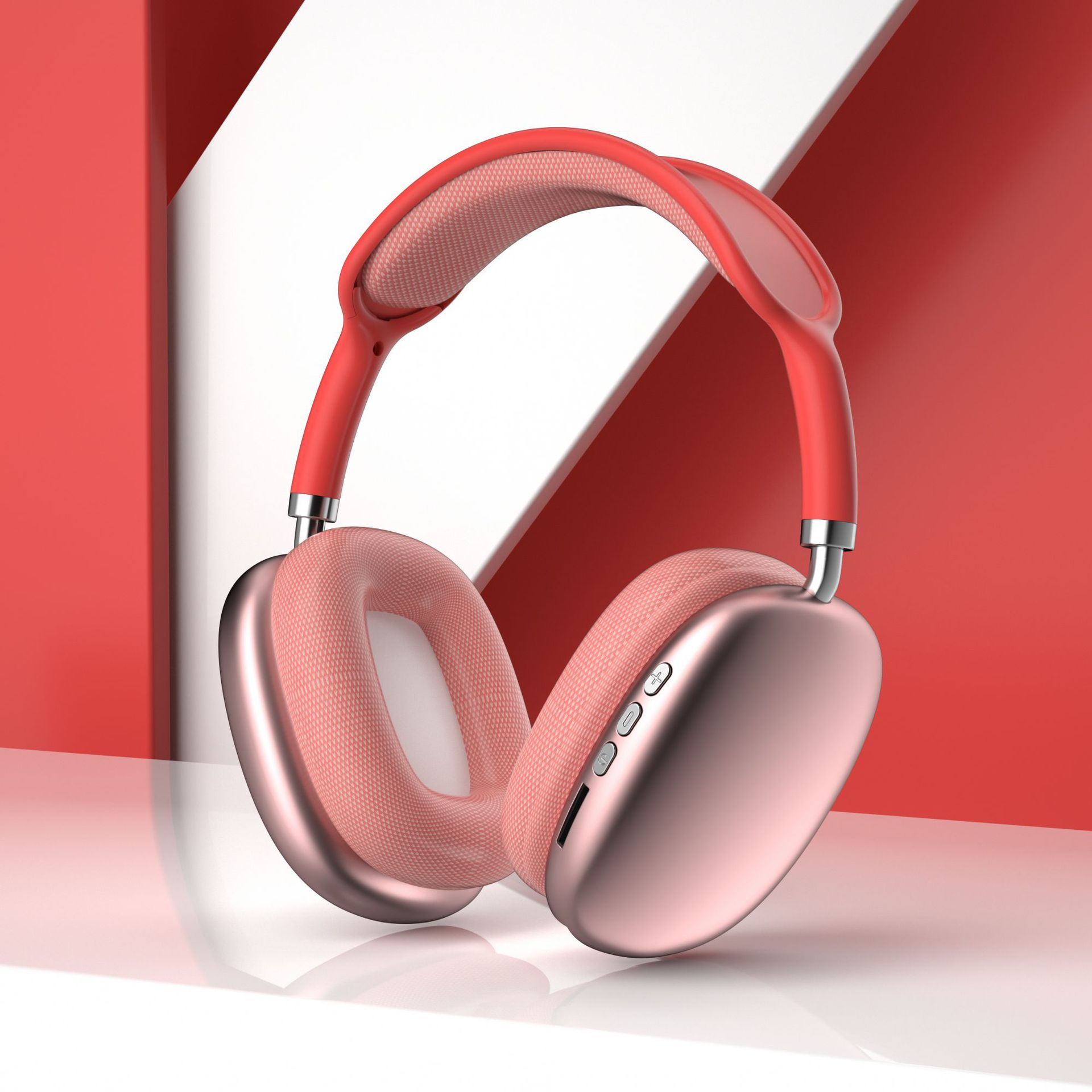 Cuffie rosa su una superficie bianca con sfondo rosso e bianco. Le cuffie sono moderne ed eleganti.