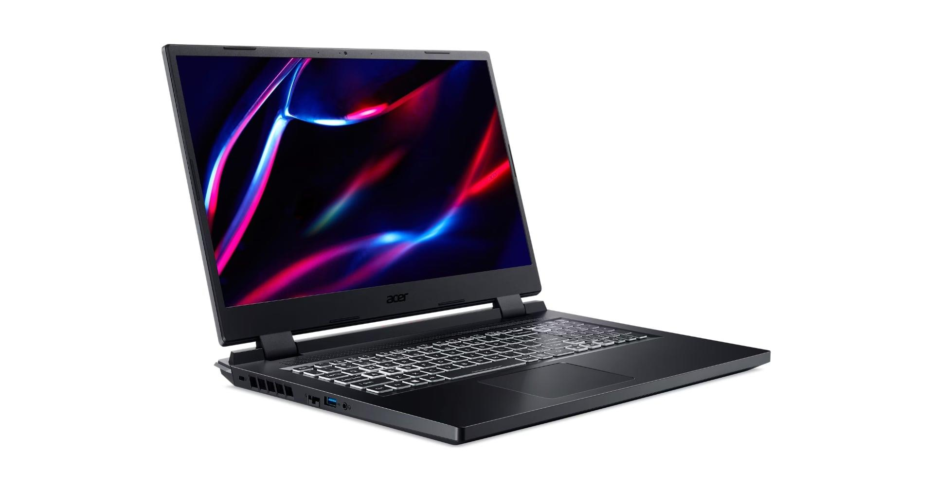 Beyaz zemin üzerinde siyah Acer laptop. Ekran, renkli soyut şekiller gösteriyor. Klavye ve dokunmatik yüzey görünür.