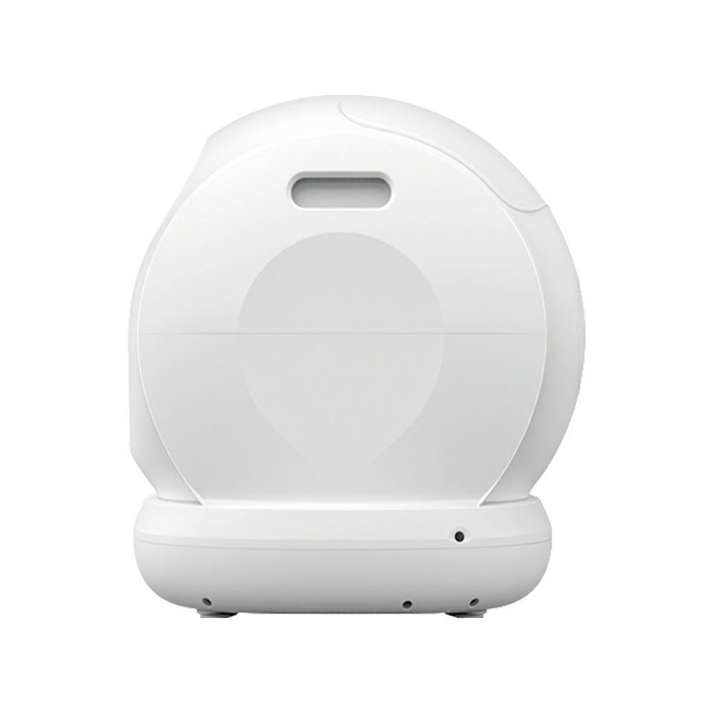 Un dispositivo bianco e arrotondato. Ha una maniglia in alto e diversi piccoli fori in basso. Il design è liscio e moderno.