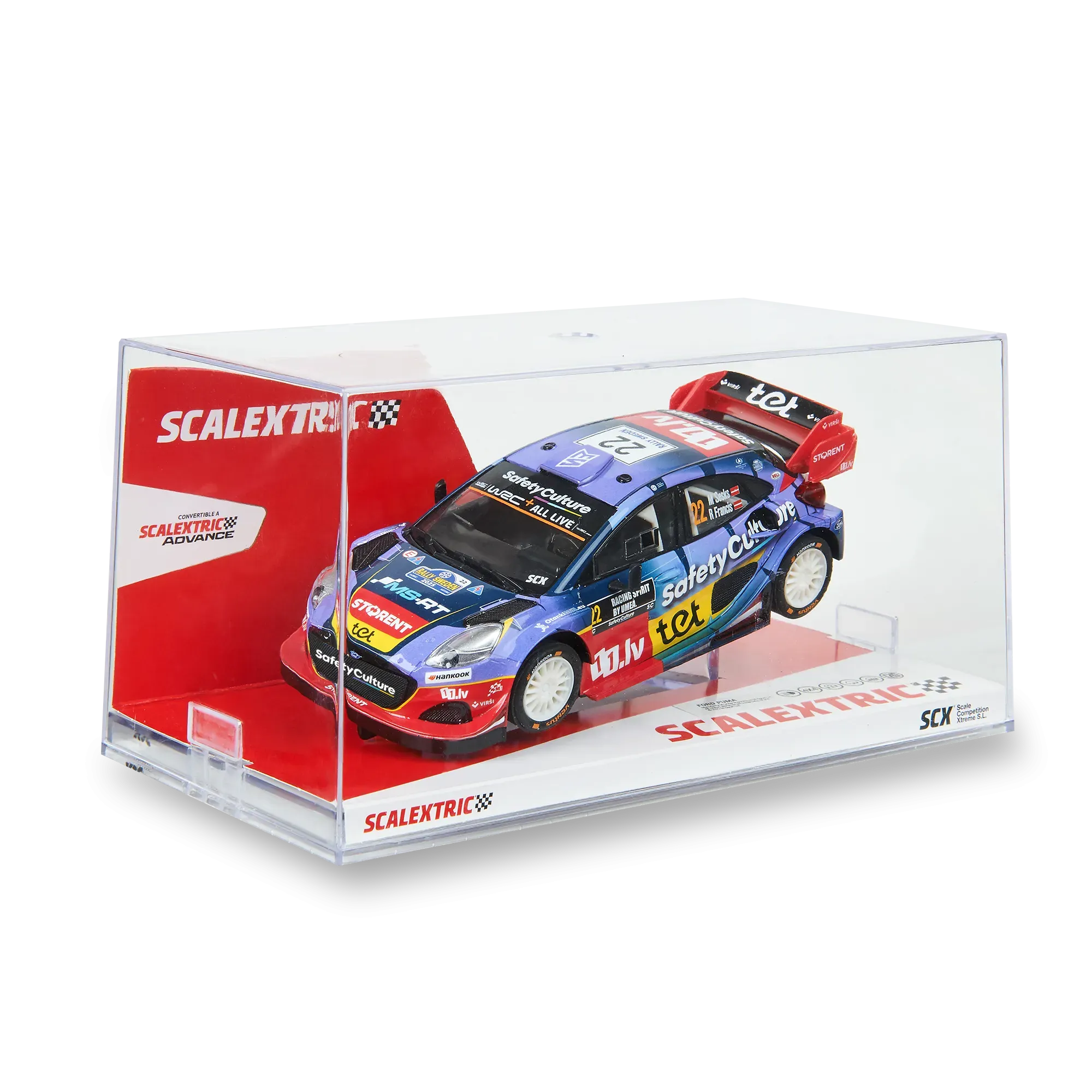 Un coche de carreras modelo en una caja transparente. Es azul, rojo y blanco. La caja tiene un fondo rojo y blanco.