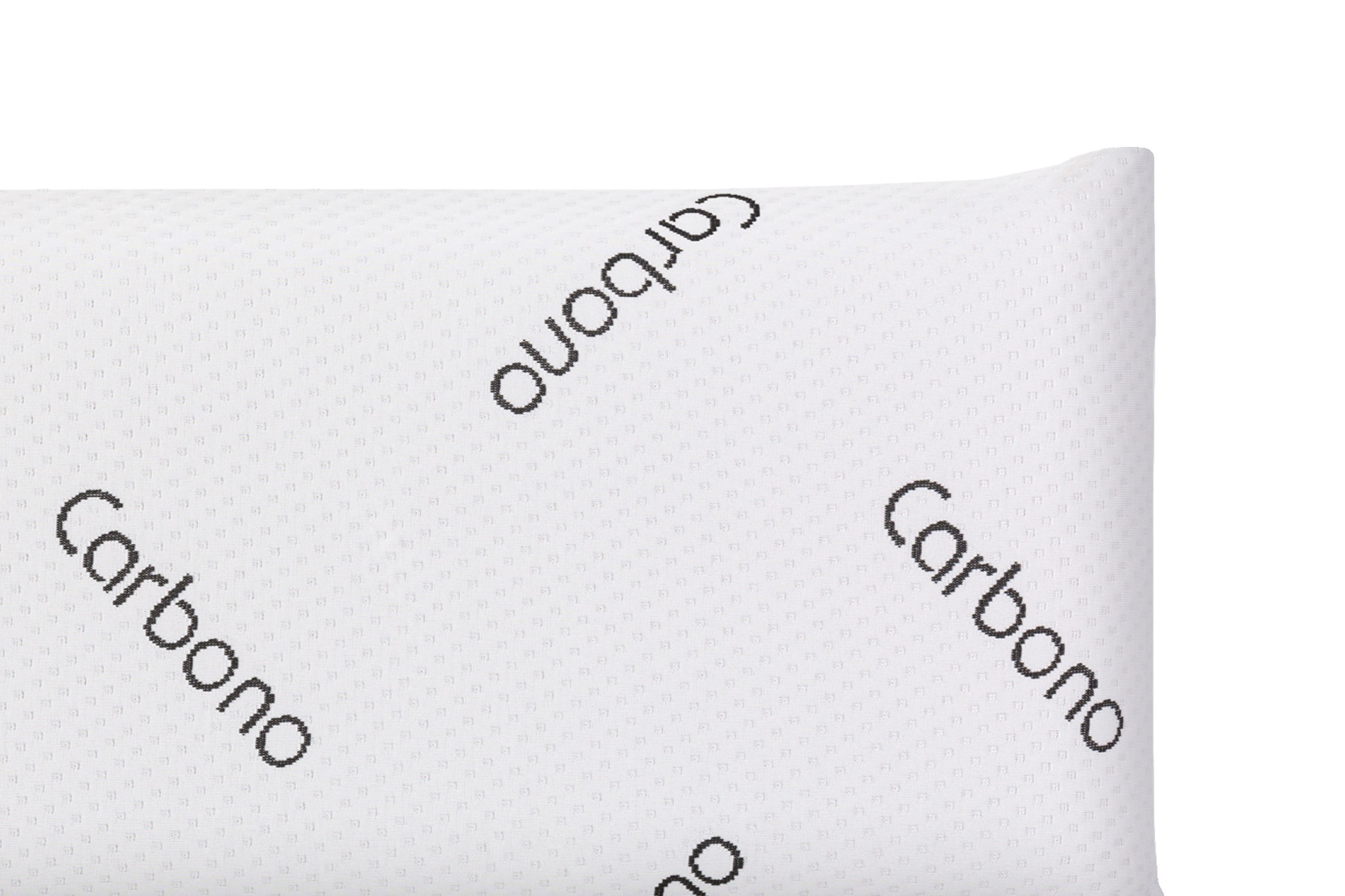 Primer plano de una almohada blanca con superficie texturizada. La palabra 'Carbono' está impresa en diagonal en negro.