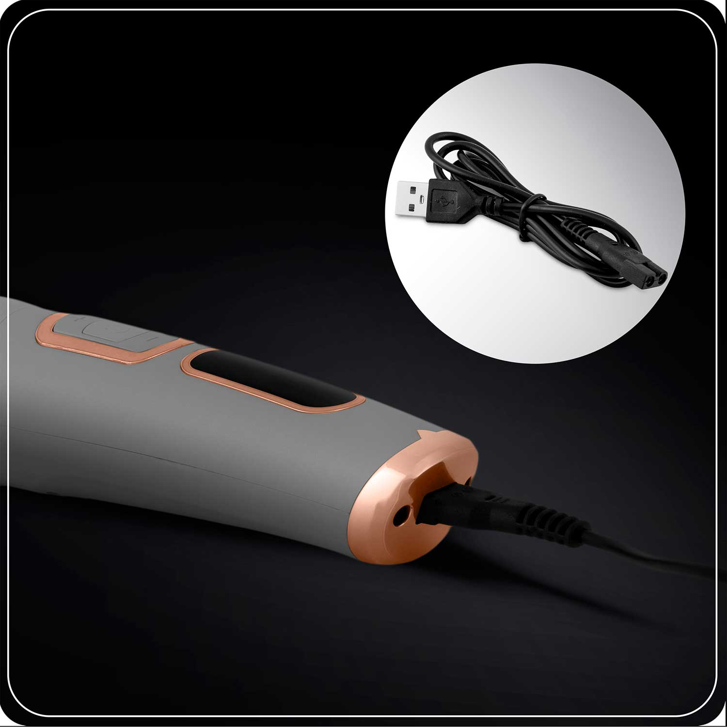 Szare urządzenie ze złotymi akcentami połączone z czarnym kablem. Okrągła wstawka pokazuje kabel z złączami USB i zasilania.