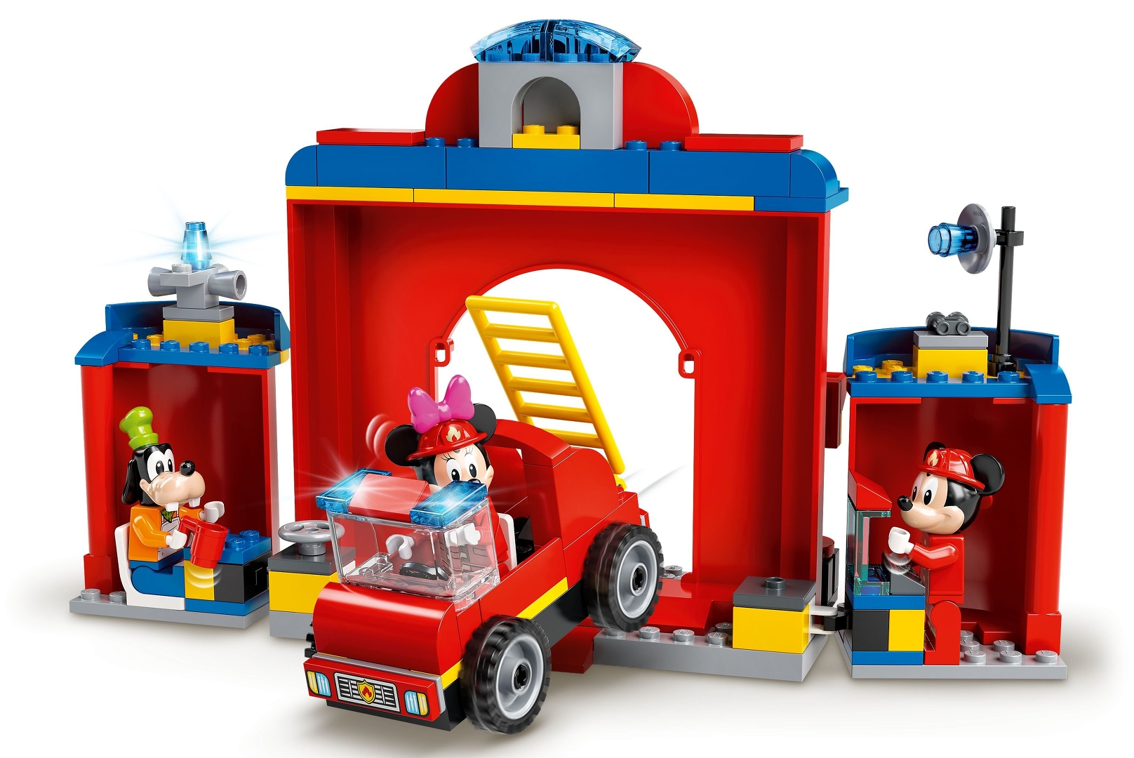 Eine Lego-Feuerwache mit Mickey- und Minnie-Mouse-Figuren. Minnie fährt einen roten Feuerwehrauto. Goofy und Mickey sind auch anwesend.