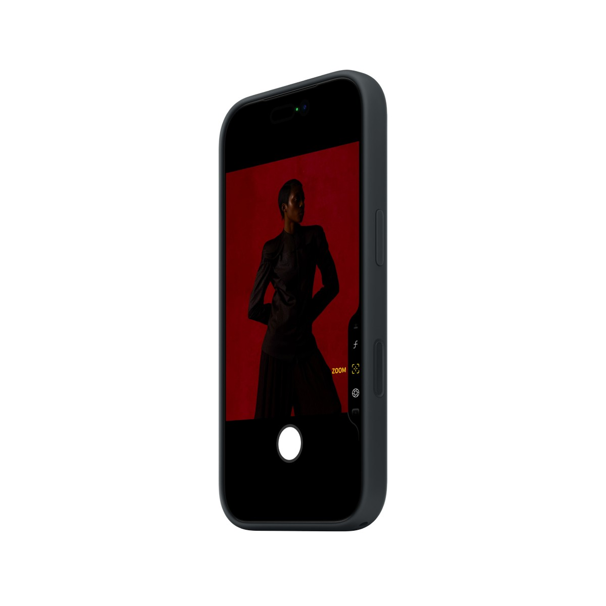 A phone displays a person in a black outfit against a red background. The phone is in a black case and is angled.