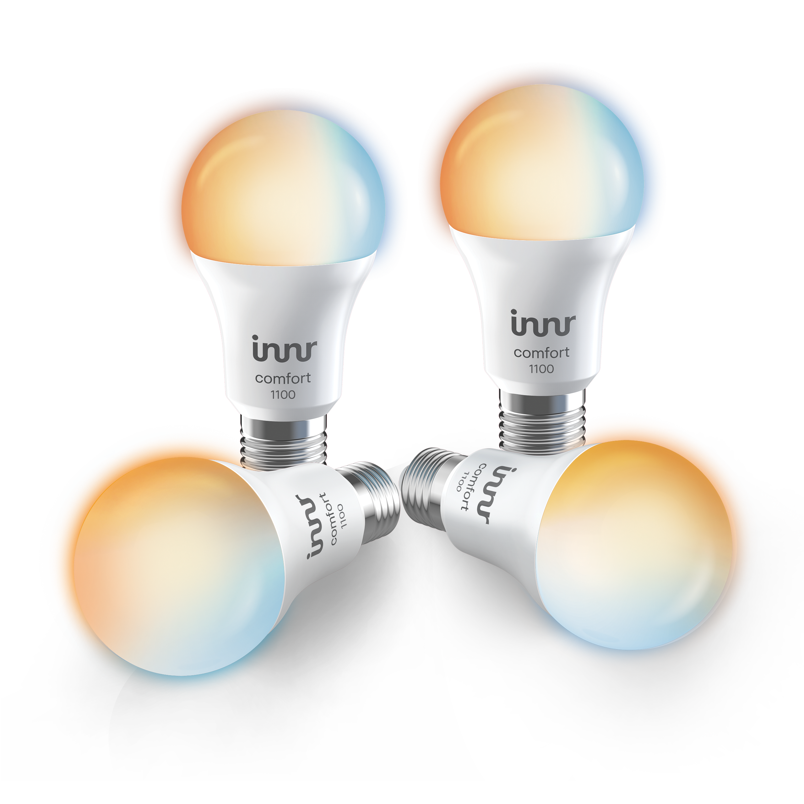 Vier witte LED-lampen met een comfort 1100-label, gloeiend met kleurovergangen op een zwarte achtergrond.