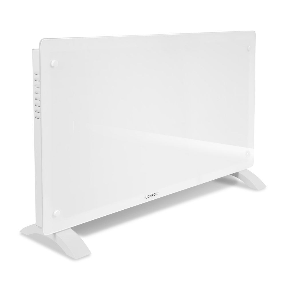 A white electric heater stands on a white surface against a white background. It has a rectangular shape and two feet.