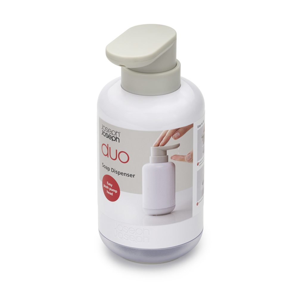 Dispensador de jabón blanco y gris. La etiqueta dice 'duo' y 'easy push pump head'. Se muestra una mano usando el dispensador.