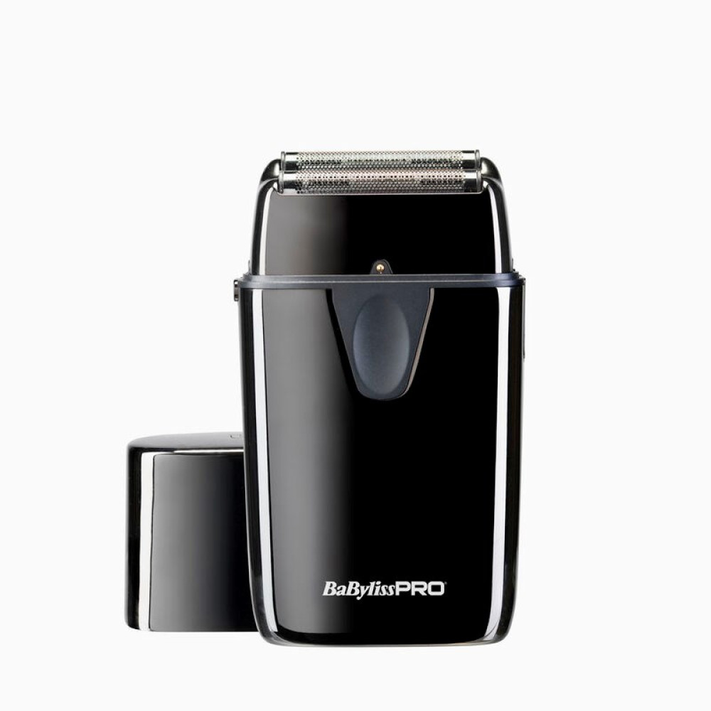 Un rasoio elettrico BabylissPRO nero senza tappo. Il rasoio ha lame argentate e un manico nero. Lo sfondo è bianco.