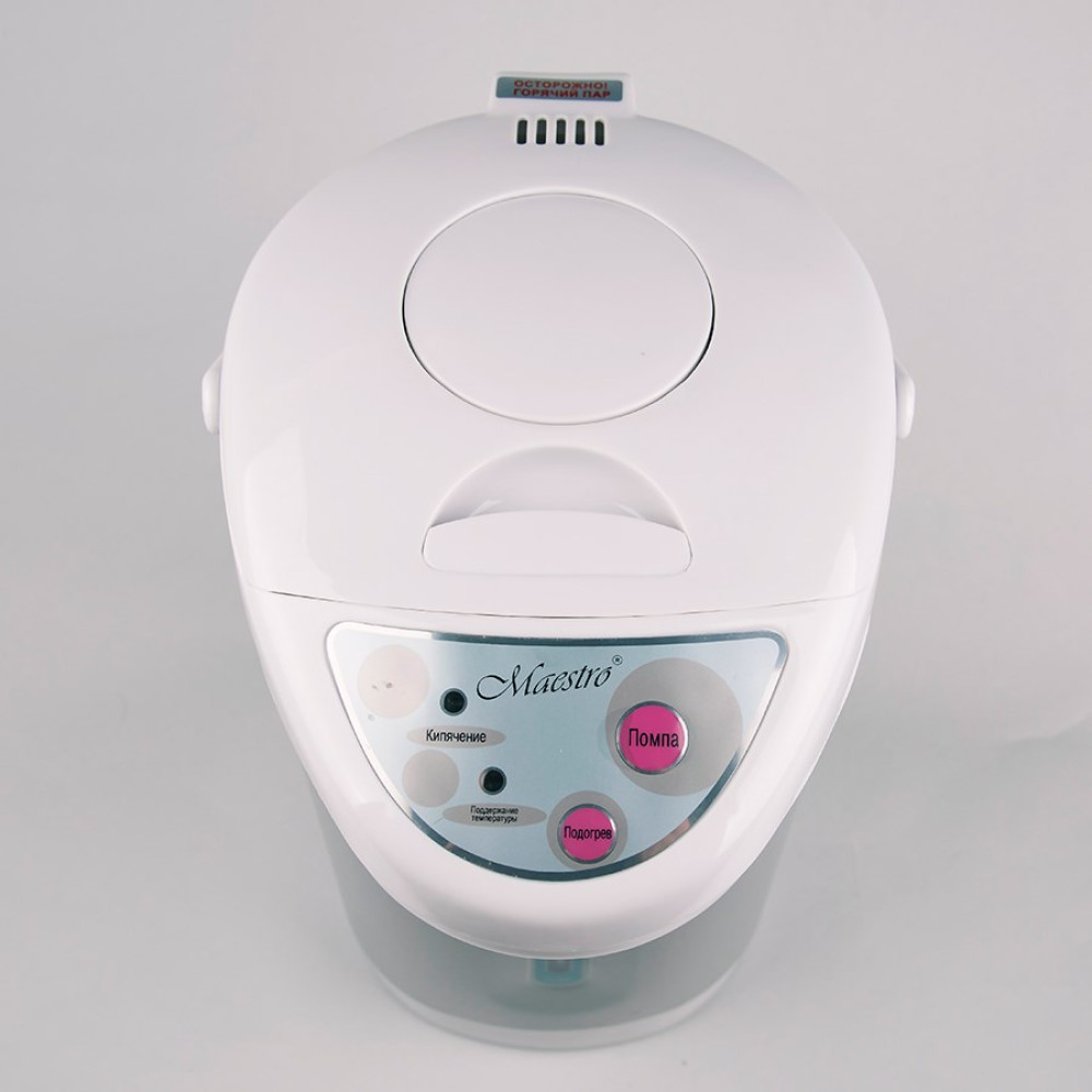 Biały czajnik elektryczny Maestro. Ma okrągły kształt. Istnieją przyciski dla różnych funkcji. Na górze znajduje się etykieta ostrzegawcza.