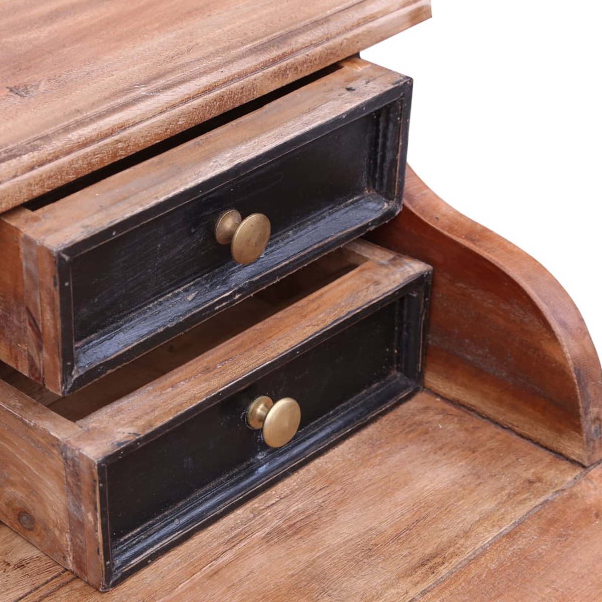 Holzschreibtisch mit zwei schwarzen Schubladen, Messingknöpfen und natürlicher Holzmaserung. Der Schreibtisch ist teilweise sichtbar.
