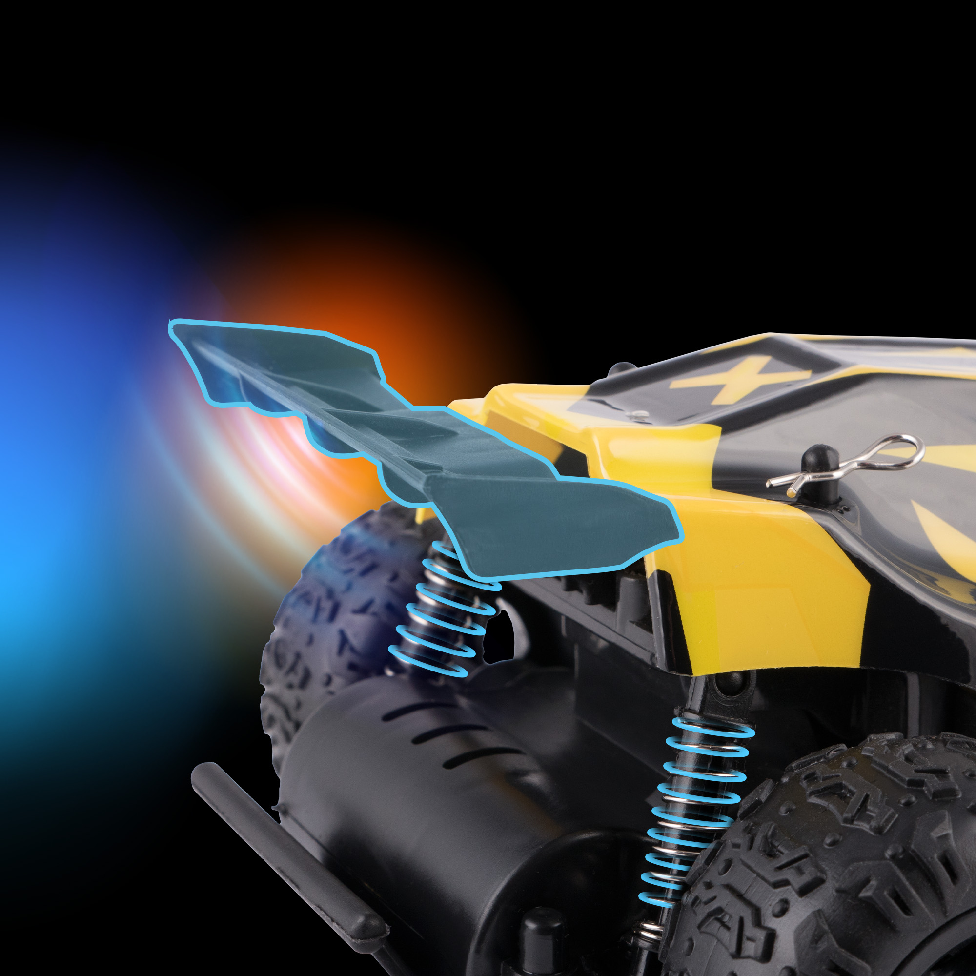 Żółto-czarny samochodzik z niebieskim spojlerem, sprężynami i oponami. Tło czarne z pomarańczowym i niebieskim rozmyciem.