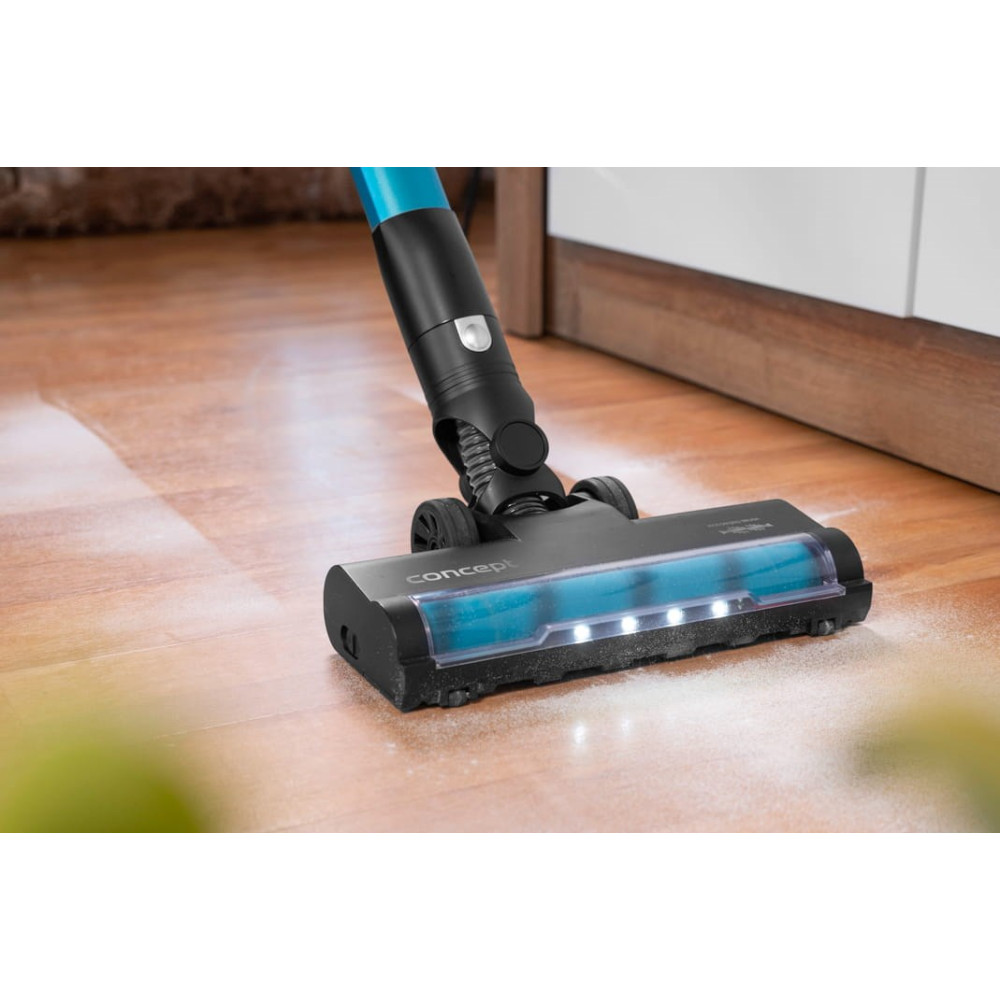 Un aspirapolvere nero e blu pulisce un pavimento in legno con polvere bianca. L'aspirapolvere ha il marchio CONCEPT.