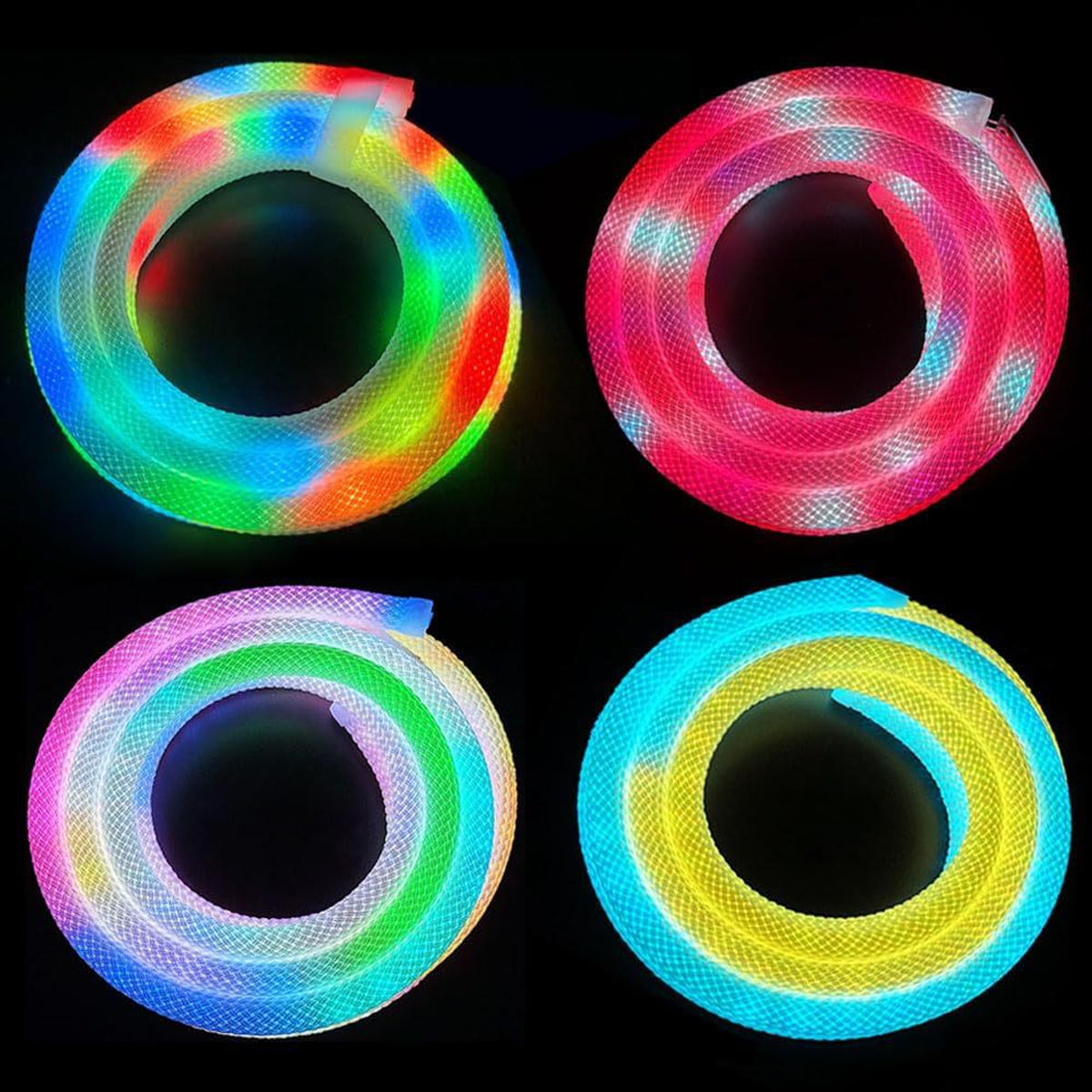 Vier aufgerollte, beleuchtete Schläuche in Regenbogen-, Rosa-, Pastell- und Gelb/Blau-Farben, vor schwarzem Hintergrund. Jeder Schlauch hat ein anderes Farbmuster.