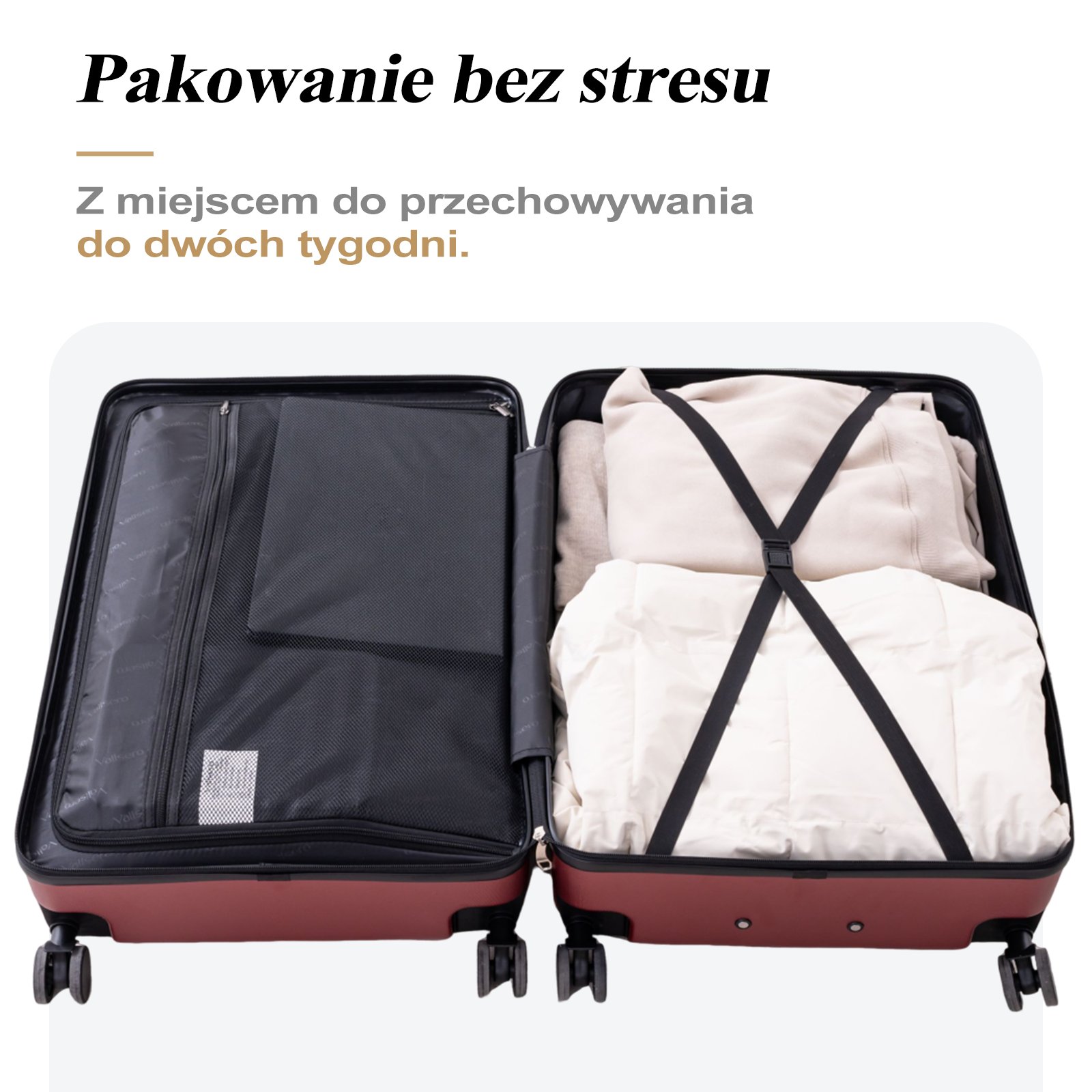 Otwarta walizka z ubraniami i przegrodą po lewej stronie. Bordowa walizka, czarne paski.