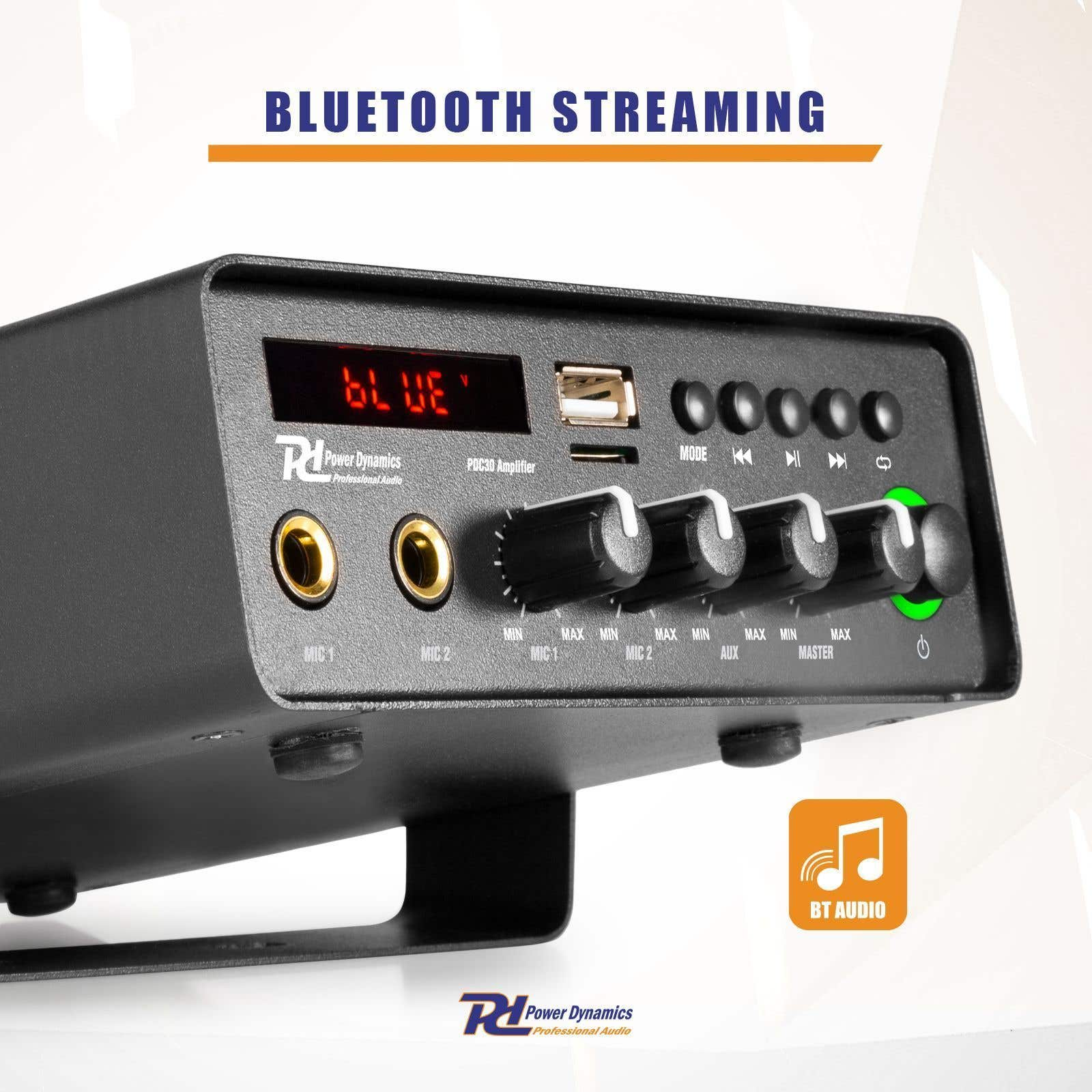 Amplificador de audio negro con perillas, botones y una pantalla digital que muestra 'BLUE'. El texto dice 'Bluetooth Streaming'.