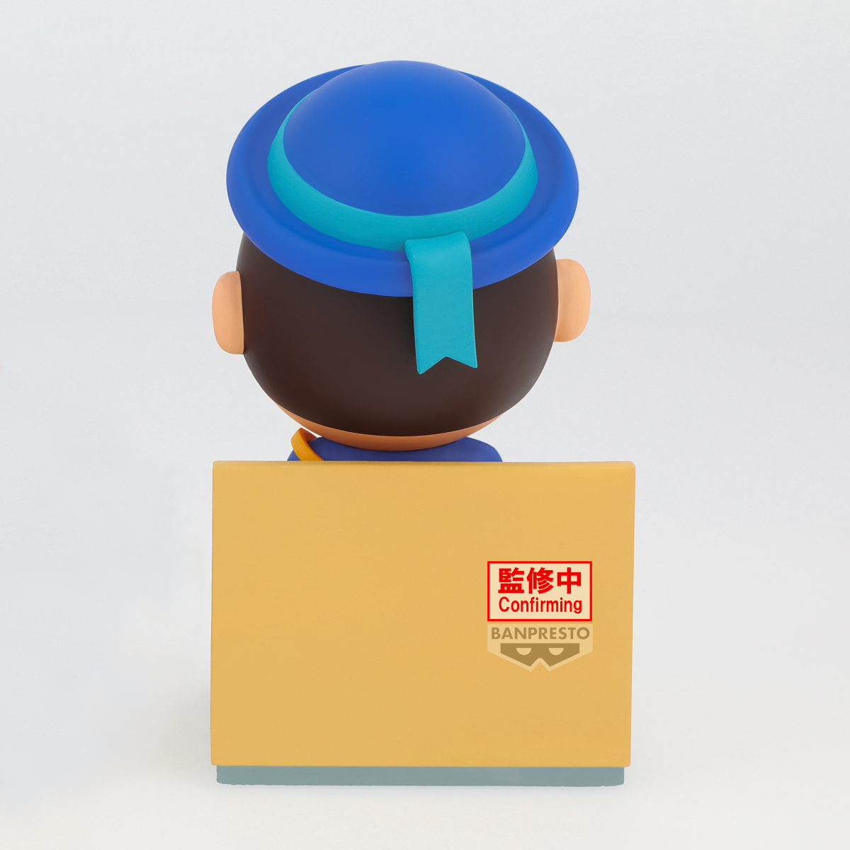 Eine Cartoonfigur mit blauem Hut steht hinter einer gelben Box mit der Aufschrift 'Confirming'. Weißer Hintergrund.