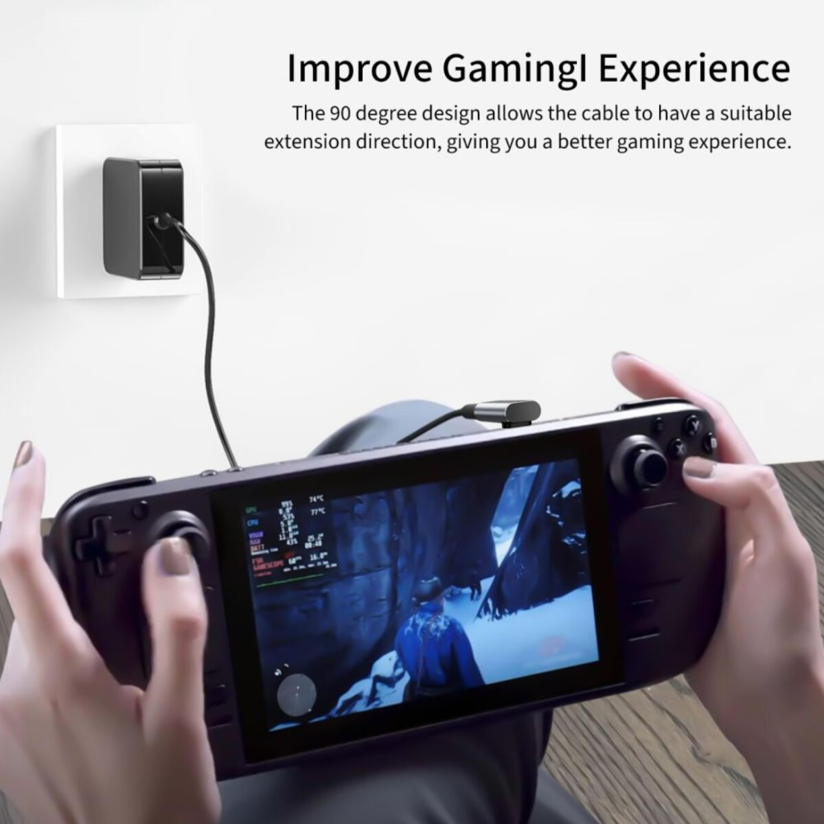 Une personne tient un appareil de jeu noir, connecté à un chargeur. L'écran affiche une scène de jeu. Superposition de texte : Améliorer l'expérience de jeu.