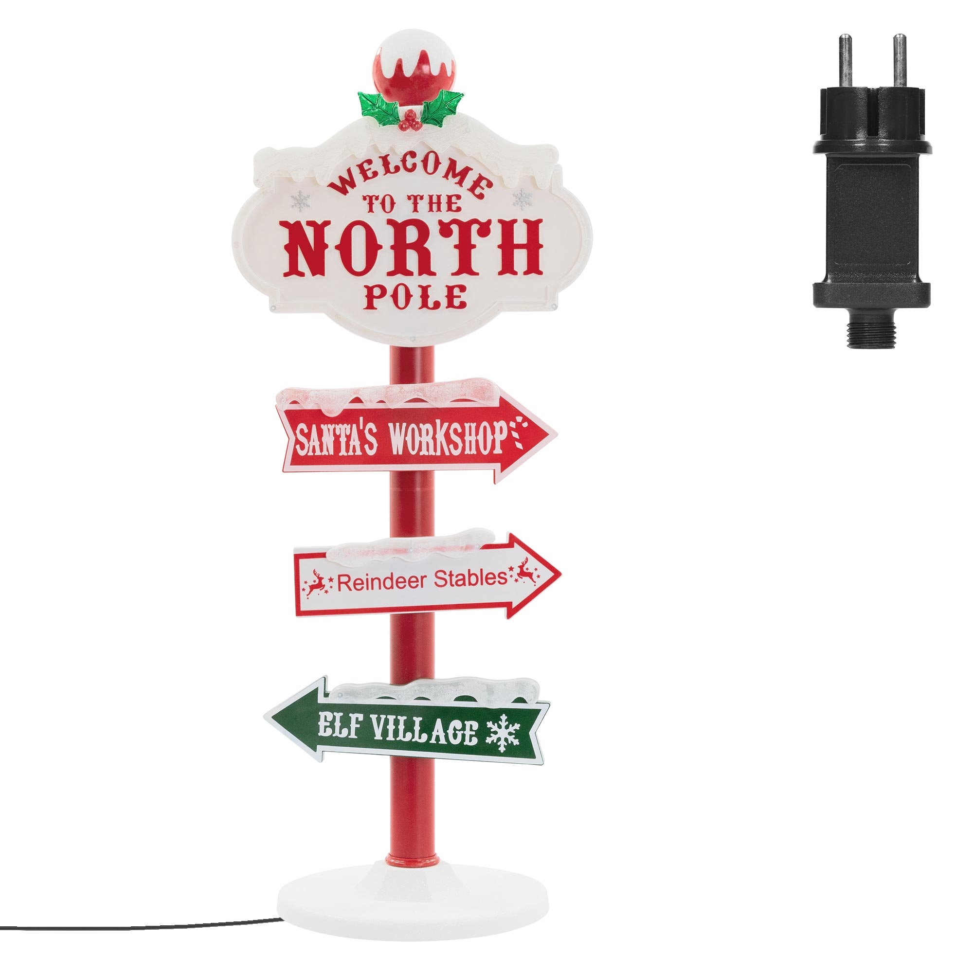 Ein Weihnachtsschild, das zum Nordpol einlädt, mit Wegweisern zur Werkstatt des Weihnachtsmanns, zu den Rentierställen und zum Elfen-Dorf.
