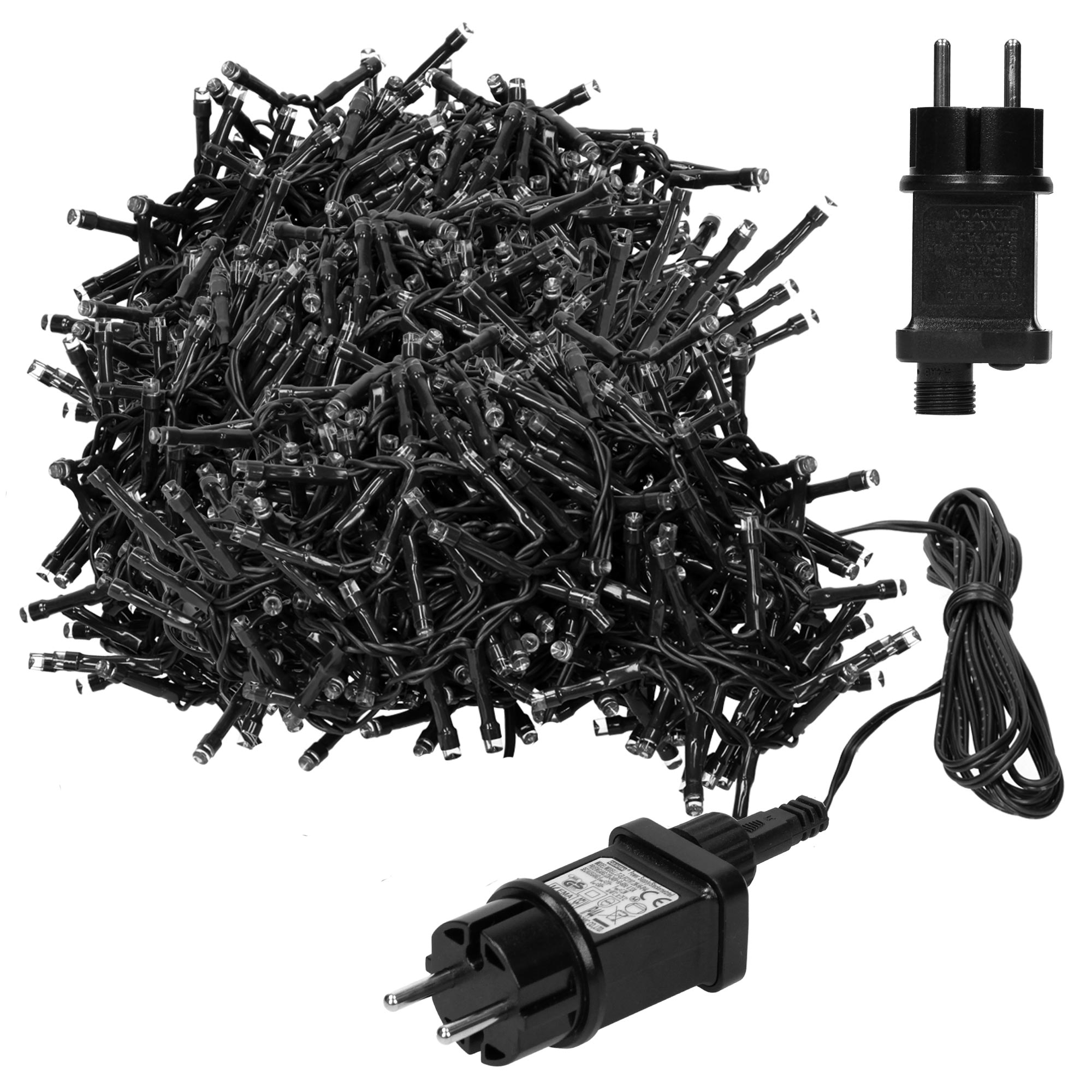 Nahaufnahme eines Haufens schwarzer Weihnachtslichter mit Stecker und Transformator.