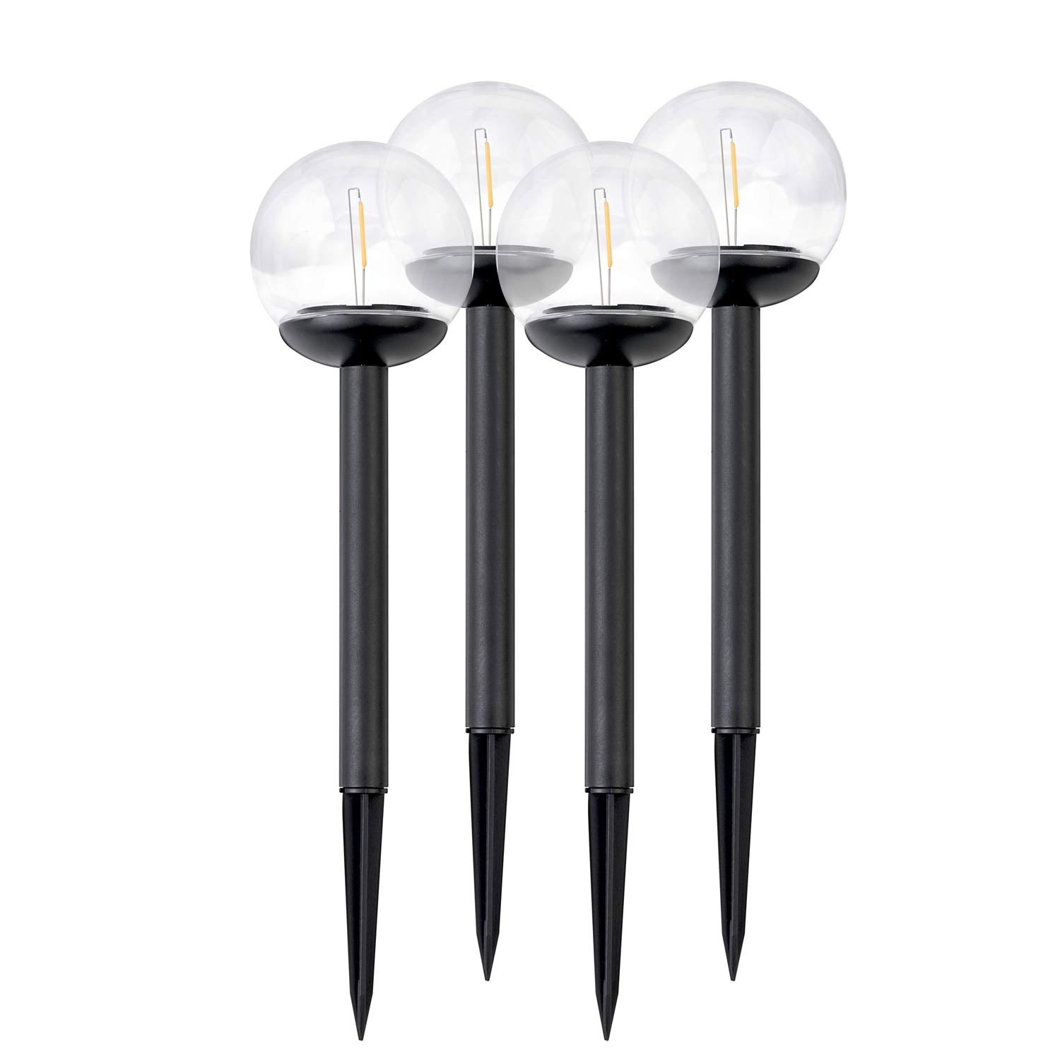 Cuatro luces de estaca negras con tapas de globo transparentes. Cada luz tiene un tallo negro y una espiga.