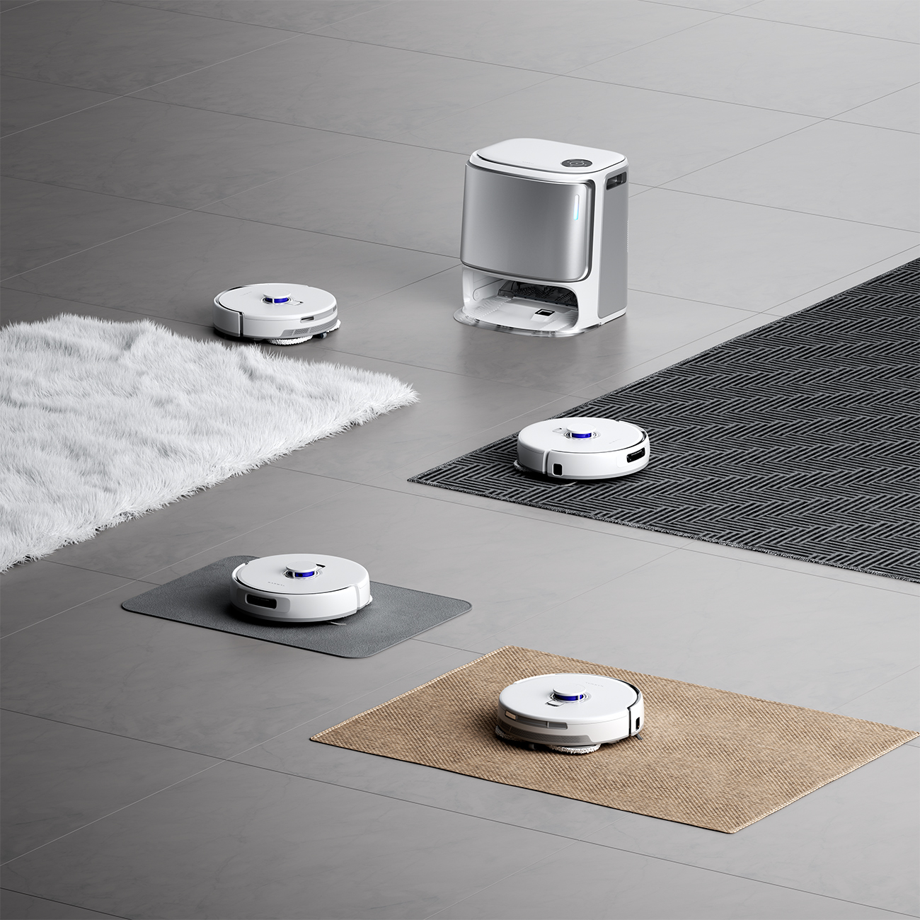 Robotyczne odkurzacze na matach i podłodze. Stacja ładująca stoi wysoko. Dywany i płytki tworzą tło.