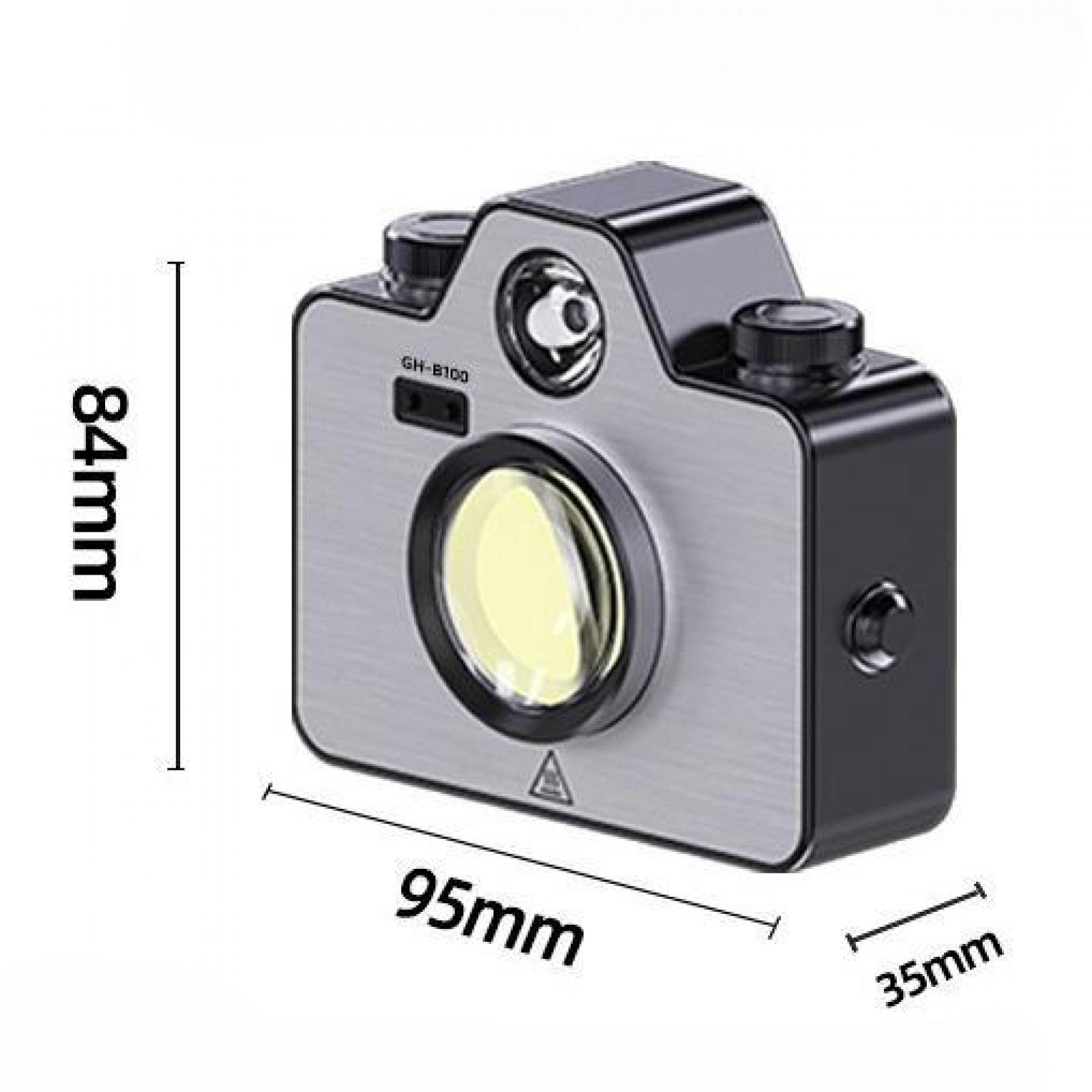 Ein silbernes und schwarzes kameraähnliches Gerät mit großem Objektiv, Knöpfen und den Maßen 84 mm, 95 mm und 35 mm.