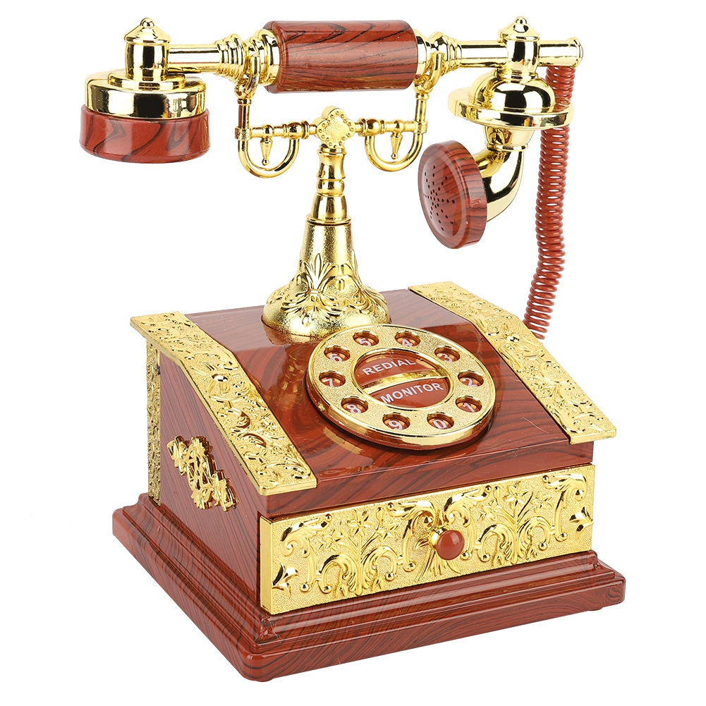 Ein antikes Telefon mit Holz- und Golddetails. Es hat eine Wählscheibe, einen Hörer und steht auf einer Holzkiste.