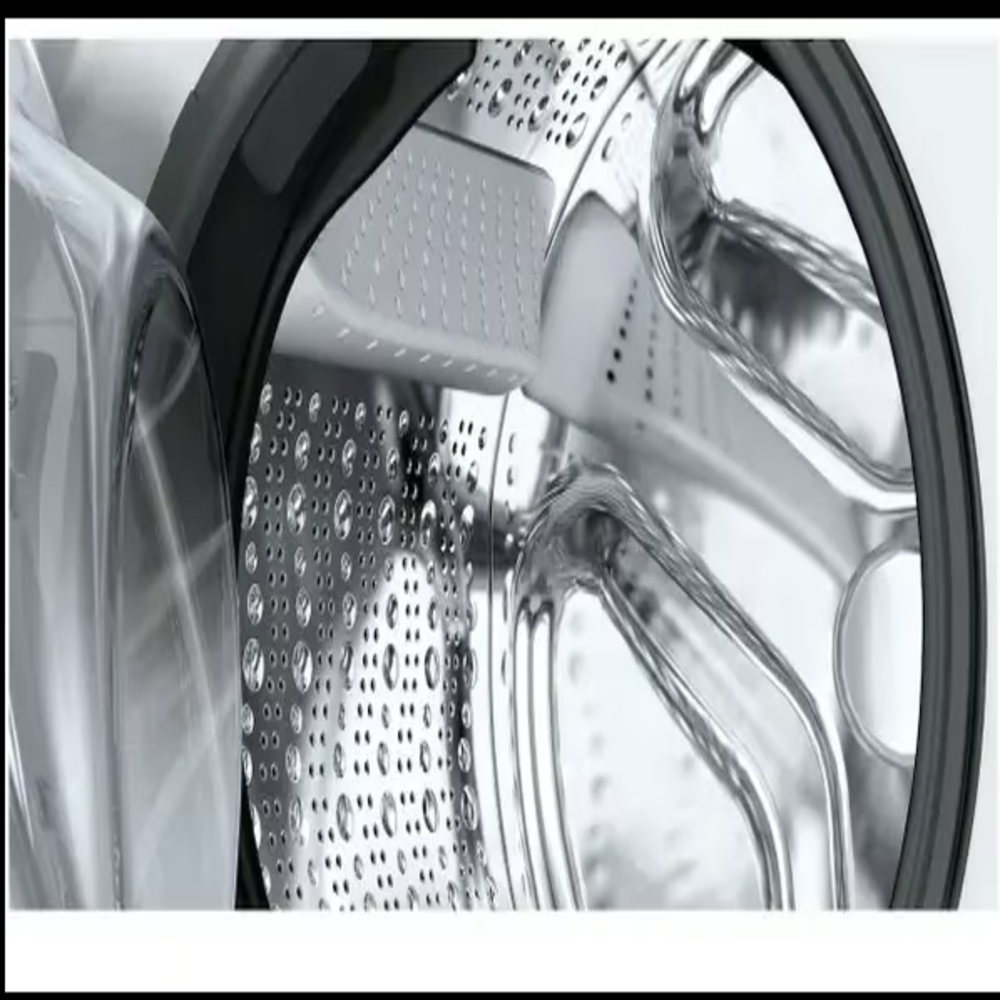 Close-up of a washing machine drum, showing water droplets on the stainless steel interior and a black rim.