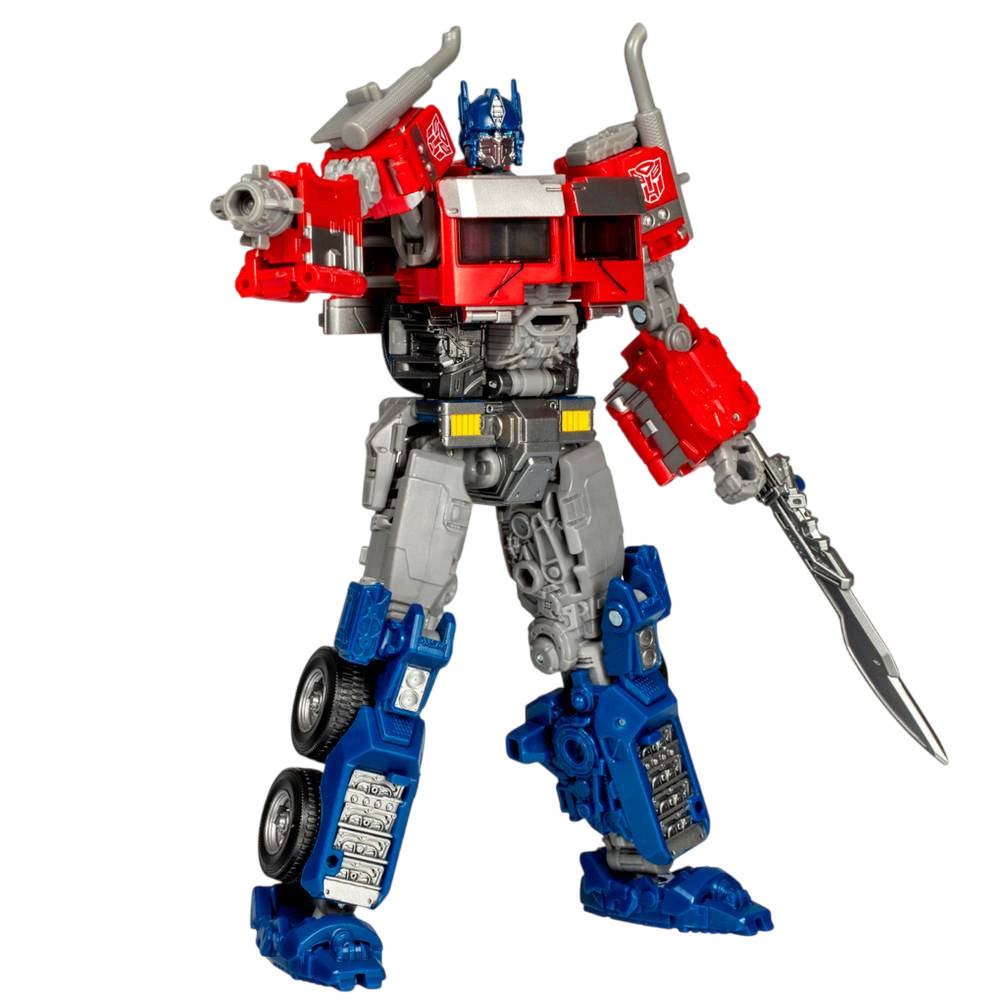 Kırmızı, mavi, gri renklerde Optimus Prime oyuncağı. Bir tabancası ve kılıcı var. Robot siyah bir arka plan üzerinde duruyor.