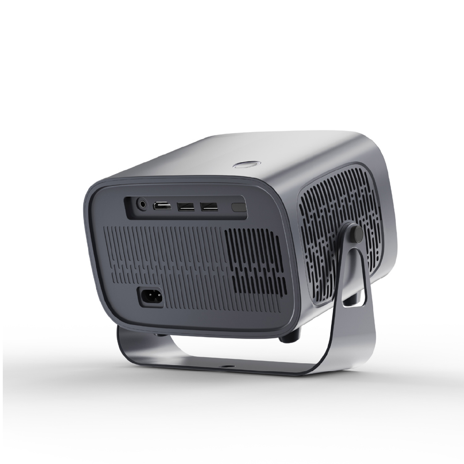 Un proyector gris sobre una superficie blanca. Tiene puertos, rejillas y un soporte curvo. El diseño es moderno y elegante.