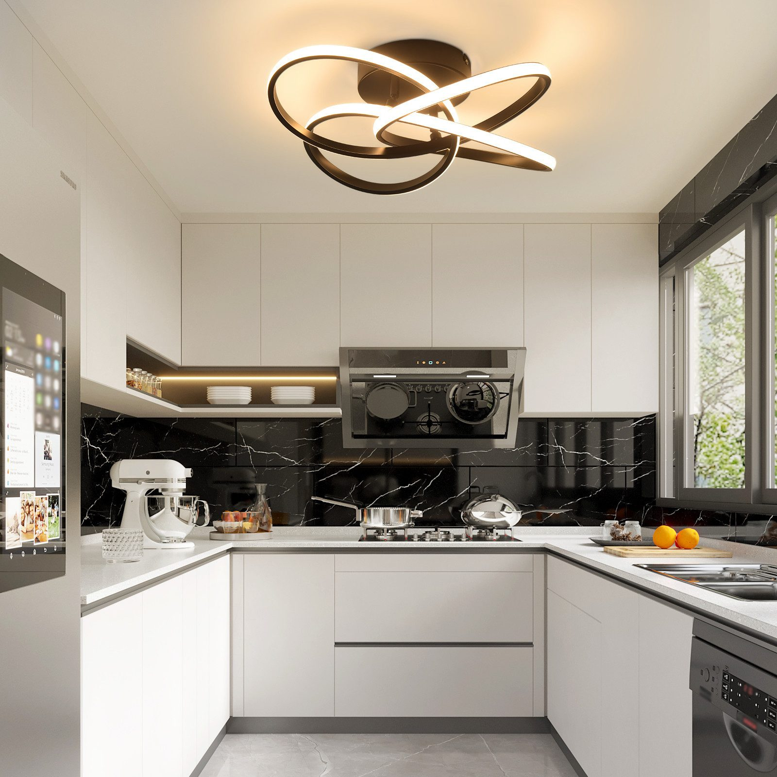 Moderna cucina bianca con alzatina in marmo nero. Include elettrodomestici, isola e lampada decorativa.
