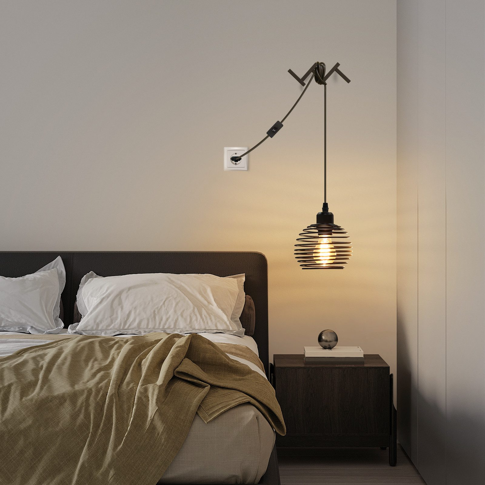 Camera da letto con letto, lampada e comodino. Una lampada nera è appesa sopra il letto. Il letto ha cuscini bianchi e una coperta marrone.