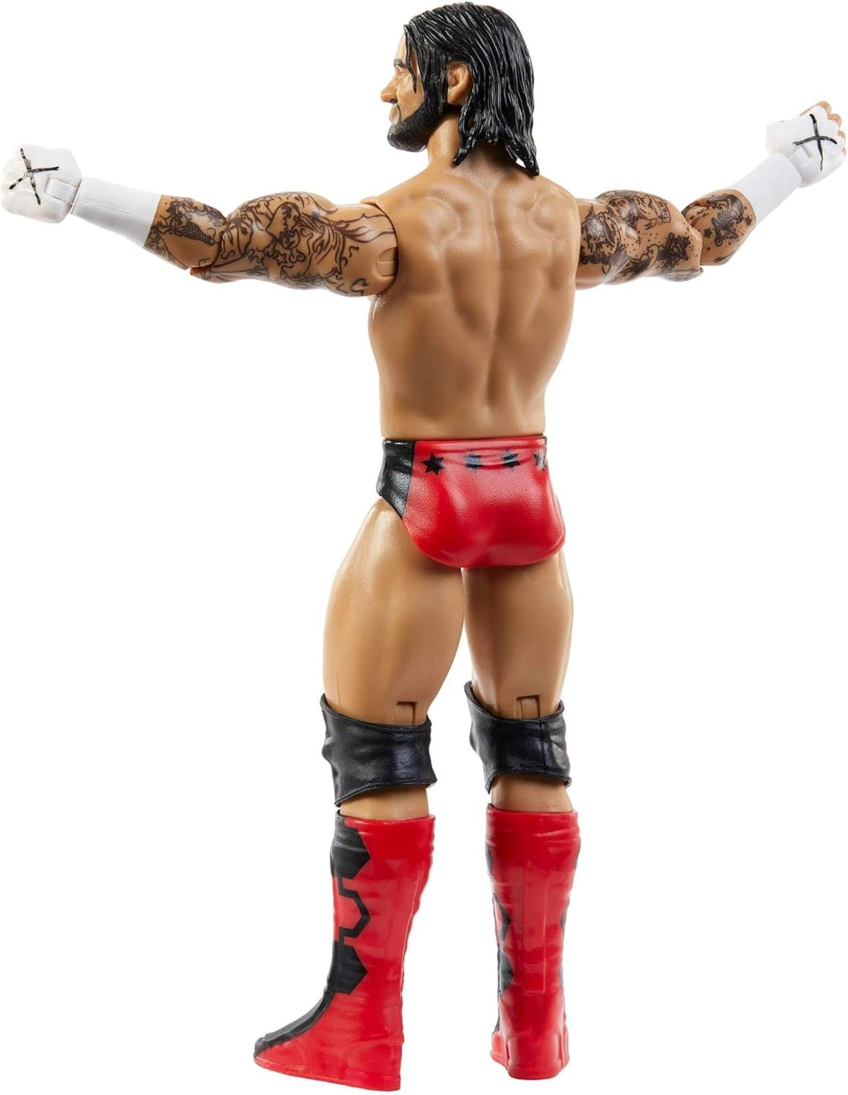 Actionfigur eines Wrestlers. Er hat Tätowierungen, schwarzes Haar und trägt rote und schwarze Shorts sowie rote Stiefel.