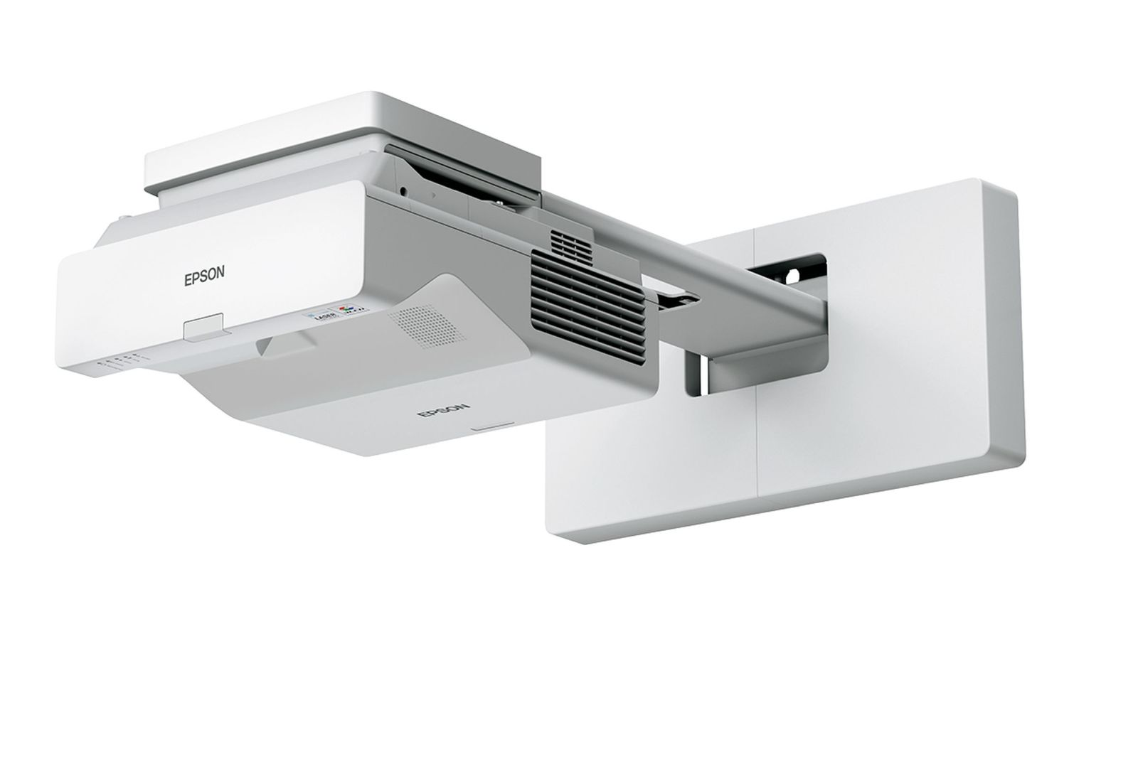 Projektor Epson jest zamontowany na białej ścianie. Projektor jest biało-szary, widoczne logo Epson.