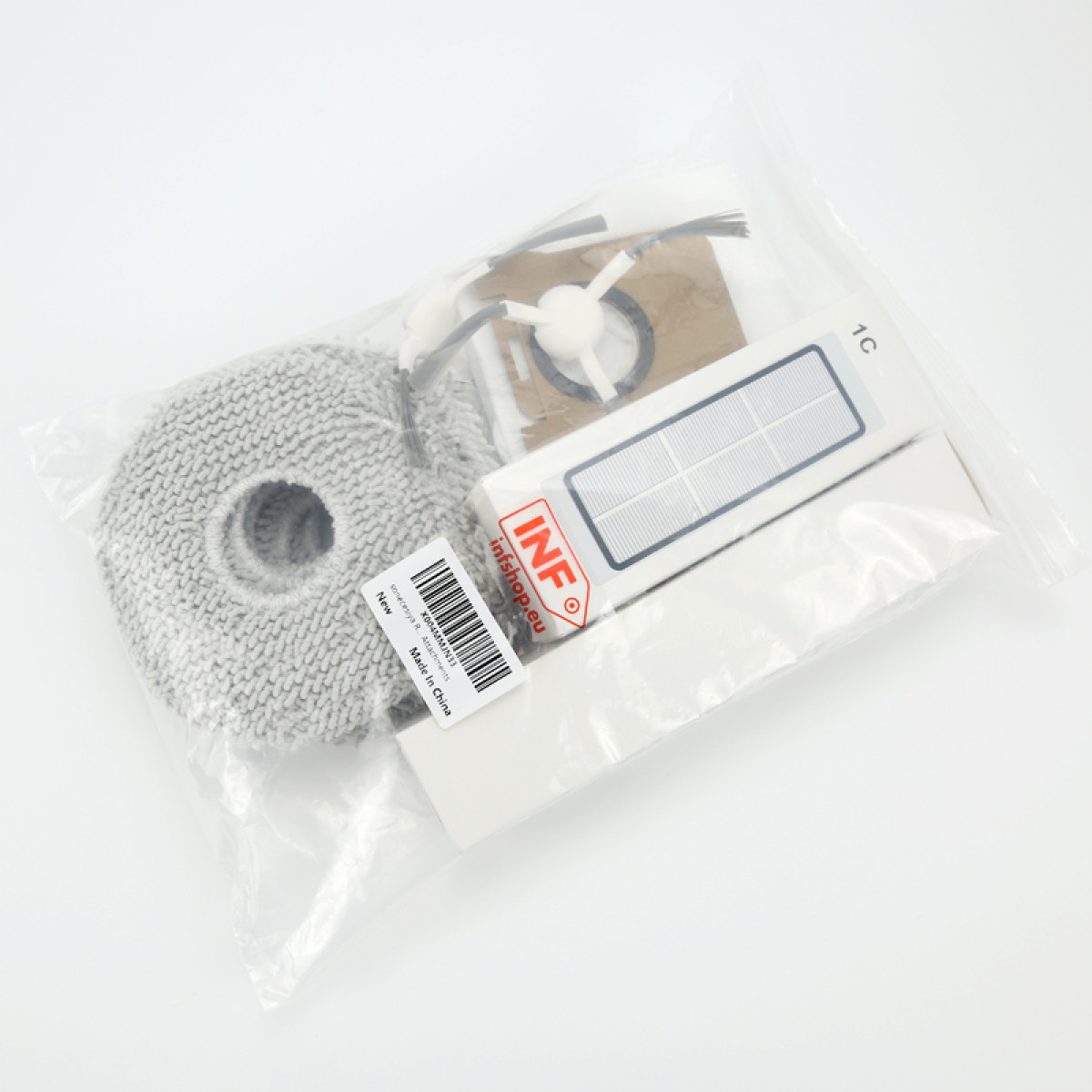 Przezroczysta plastikowa torba zawierająca akcesoria do robota sprzątającego. Zawiera szarą nakładkę do mopa, filtr, szczotki i naklejkę.