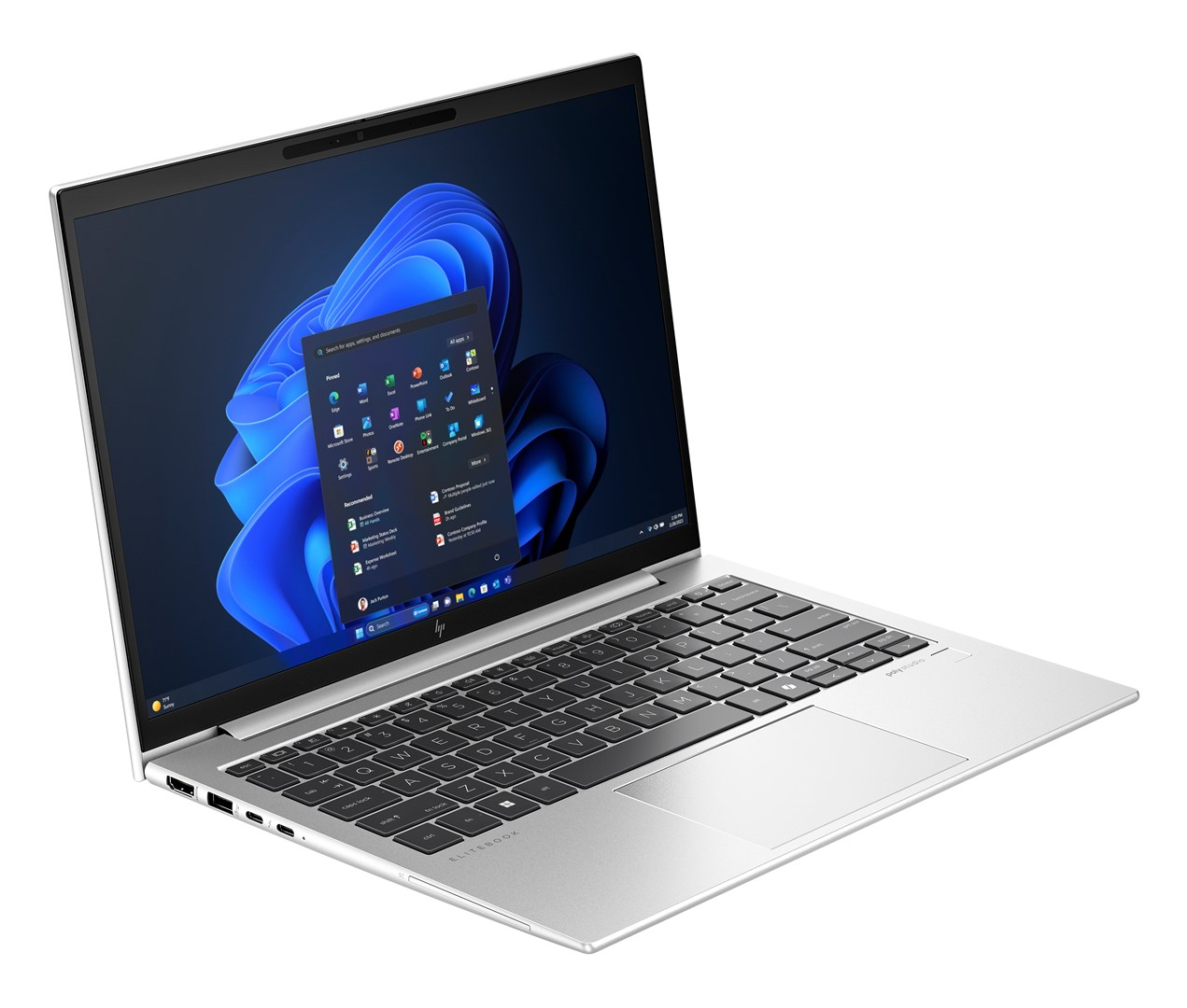 Srebrny laptop HP Elitebook jest otwarty. Ekran wyświetla Windows 11 z niebieskim wirującym tłem i ikonami aplikacji.