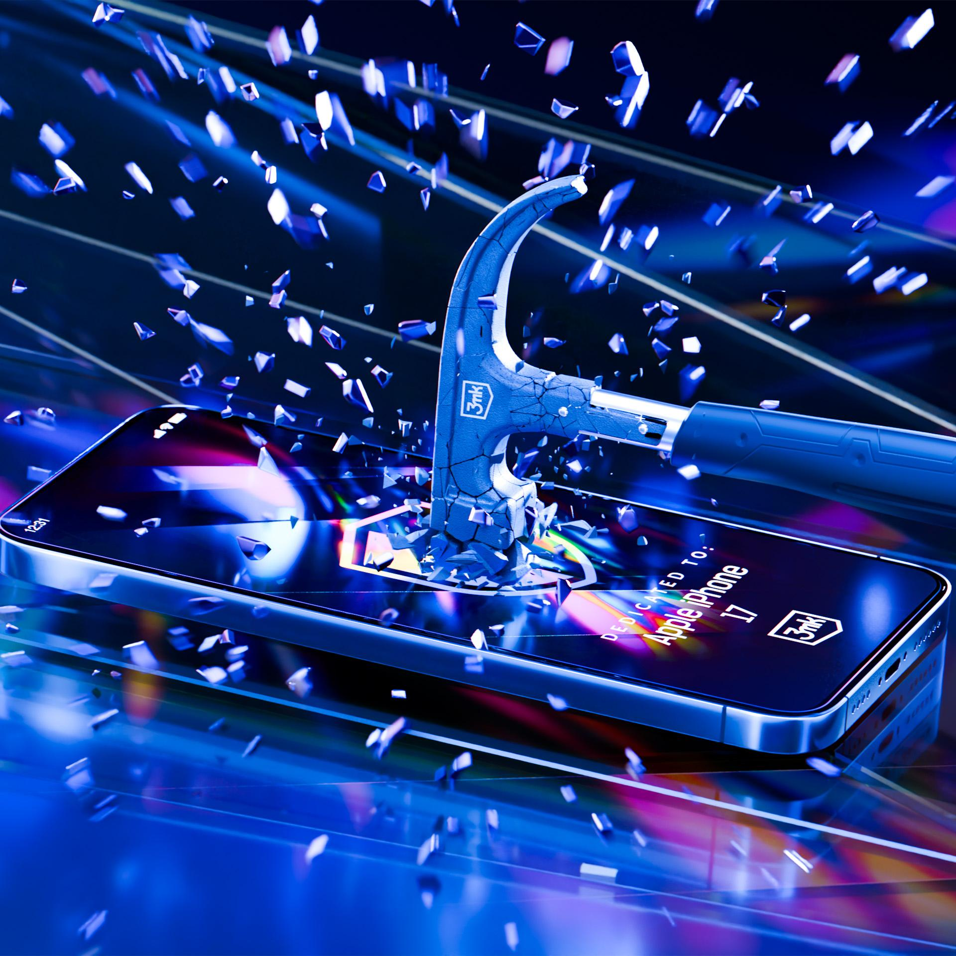 Niebieski młotek rozbija ekran telefonu. Odłamki ekranu lecą. Telefon wyświetla 'Apple iPhone 17'.