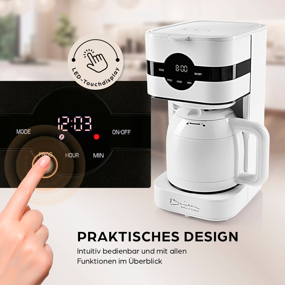 Una macchina da caffè bianca con display digitale 12:03. Una mano tocca il pulsante 'PROG'. Testo: Design pratico.