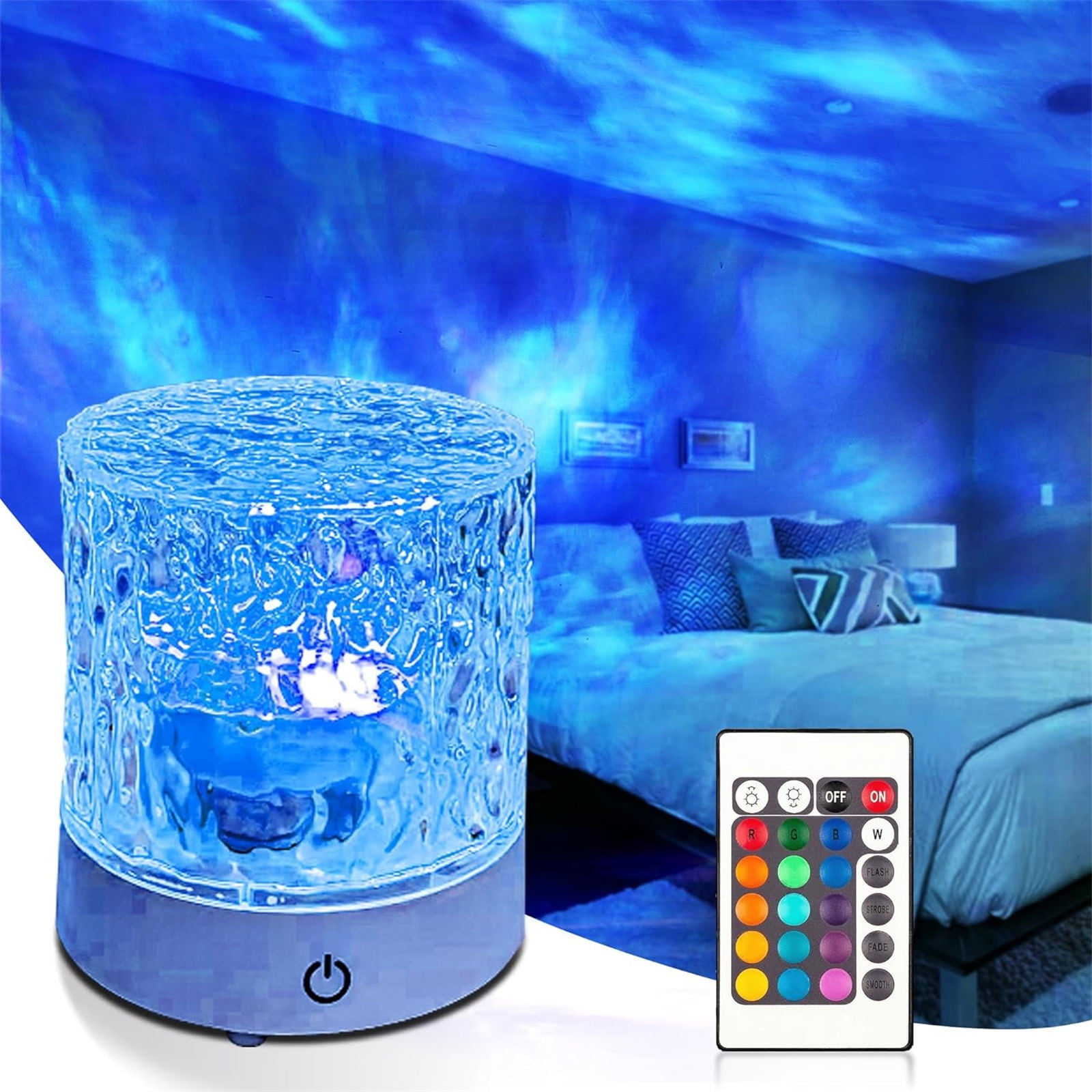 Ein blaues Nachtlicht projiziert einen Sternenhimmel an die Schlafzimmerdecke. Eine Fernbedienung und ein Bett sind im Hintergrund.