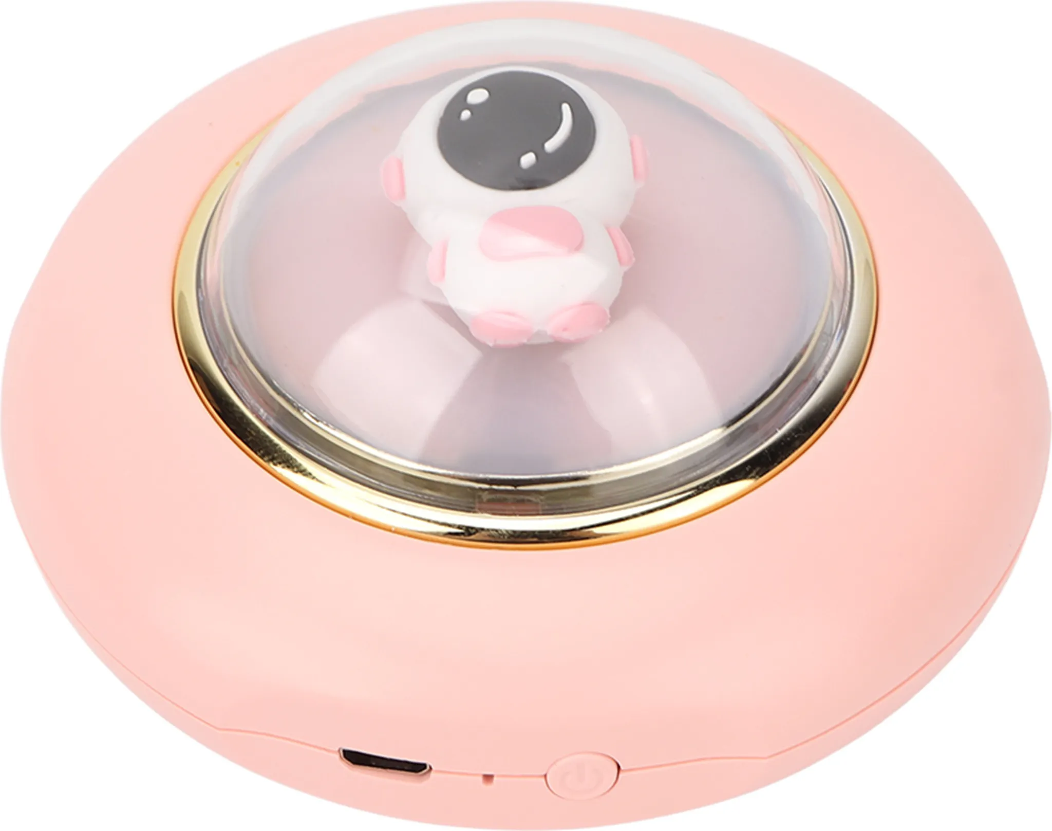 Ein rosa, rundes Gerät mit einer transparenten Kuppel. Innen eine kleine Astronautenfigur. Goldrand um die Kuppel.