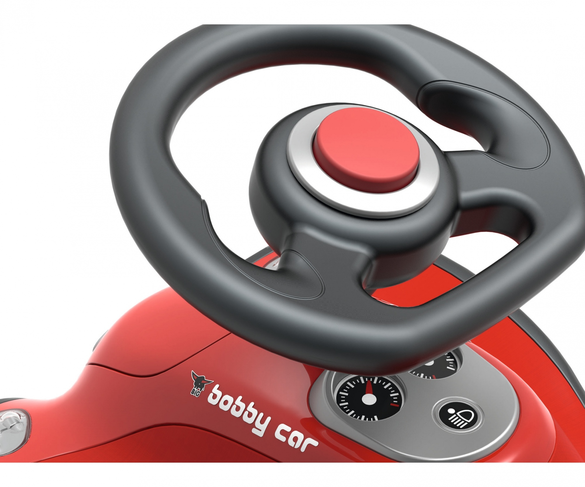 Rotes Spielzeugauto-Lenkrad. Das Lenkrad ist schwarz und hat einen roten Mittelknopf. Die Karosserie des Autos ist rot.