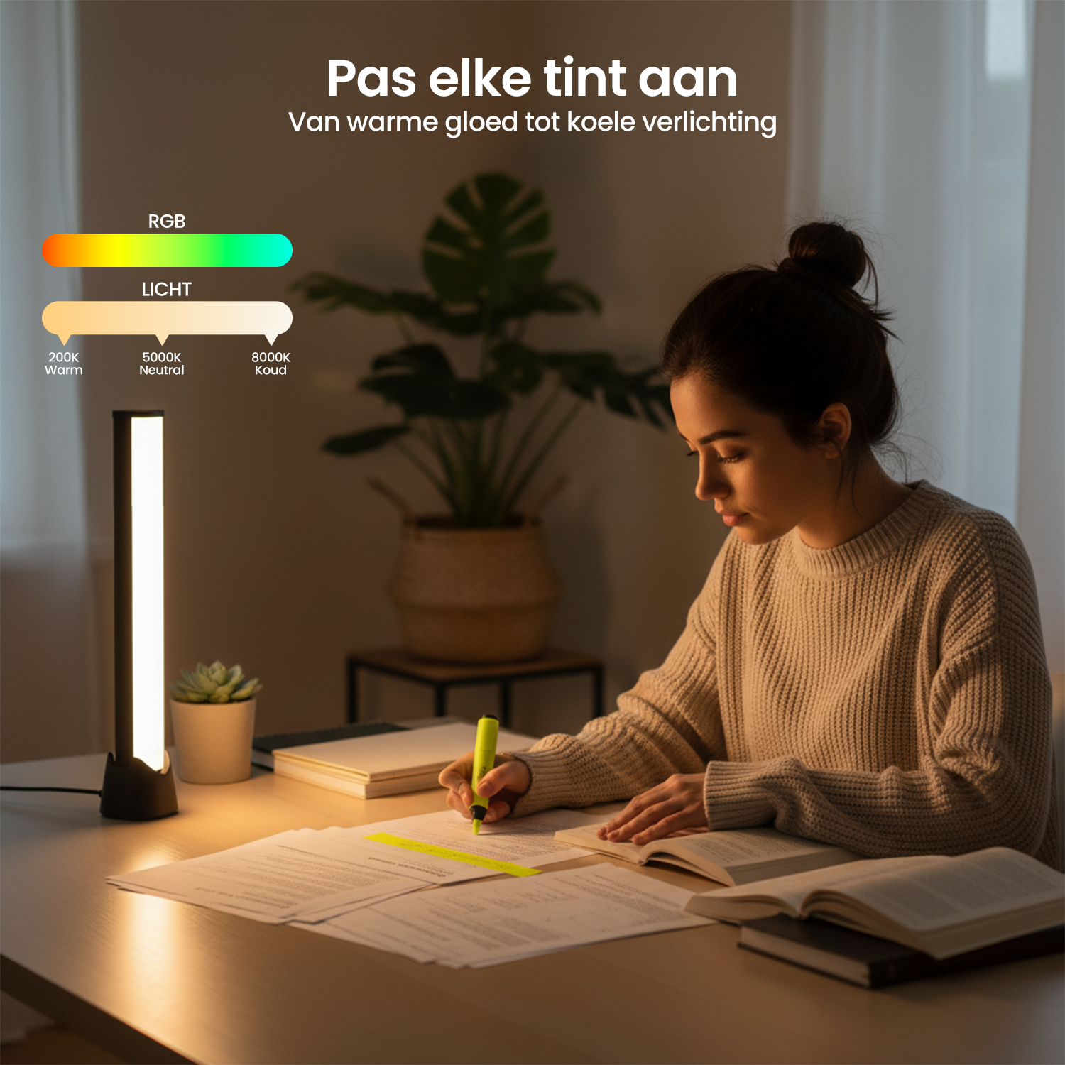 A woman studies at a desk lit by an adjustable lamp. There are papers, books, and a plant. The lamp’s color temperature can be adjusted.